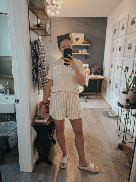 Target outfit idea! 🎯 Spring and summer outfits are my favorite, so I threw together a monochrome easy summer outfit using all Target fashion. I combined the best $20 striped linen shorts with my neutral “manifest” t-shirt, tan (off-white) rubber slide sandals, and of course, my favourite tortoiseshell sunglasses. 🕶️ 
Affordable, stylish fashion is TOTALLY possible on a budget, and this outfit is giving weekend wear / stylish mom outfit / summer outfit vibes. I can’t wait to wear it to the beach, running errands, play dates - you name it! I’m wearing a medium in the shorts and a large in the t-shirt for an oversized fit  

#LTKmidsize #LTKfindsunder50 #LTKstyletip