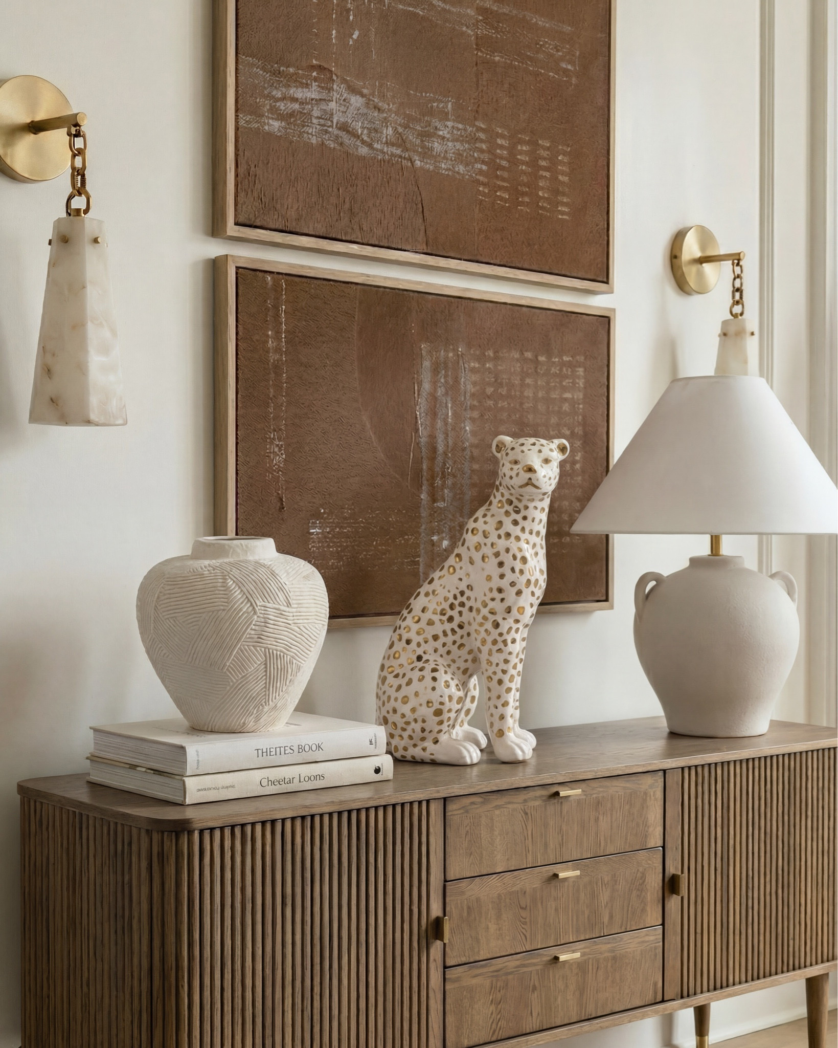 Shop the look:
* upholstered bed cream textured fabric
* channel tufted bed neutral
* boucle bench ivory curved modern
* ribbed wood nightstands dark walnut
* curved wood dresser fluted front
* modern vintage dresser brass hardware
* boucle accent chair cream wood legs
* brass chandelier modern candle style
* gold minimalist chandelier linear arms
* brass wall sconces stone shade
* alabaster wall sconces gold
* ceramic table lamp cream base white shade
* moody floral wall art large canvas
* gold scalloped wall mirrors
* decorative ceramic vase large neutral
* greenery stems in ceramic vase
* black and brown patterned throw pillow
* stacked neutral coffee table books
* decorative stone bowl tray
* white duvet cover luxury hotel style
* chunky knit throw blanket brown
* neutral throw blanket layered bedding
* white pillows minimal bedding
* textured cream bed upholstery
* brown cream geometric area rug
* diamond pattern rug neutral tones
* vintage inspired rug brown beige
* neutral bedroom ideas
* beige and brown bedroom decor
* luxury neutral bedroom
* organic modern home decor
* cozy minimalist bedroom
* designer inspired bedroom
* timeless bedroom design
* Rectangular wood dining table
* Solid wood pedestal dining table
* Dark walnut dining table
* Traditional farmhouse dining table
* Cane back dining chairs
* Woven rattan dining chairs
* Upholstered seat dining chairs
* Mid-century traditional dining chairs
* Wooden sideboard cabinet
* Fluted wood sideboard
* Vintage-style display cabinet / hutch
#LTKSaleAlert

#LTKsale #LTKhome