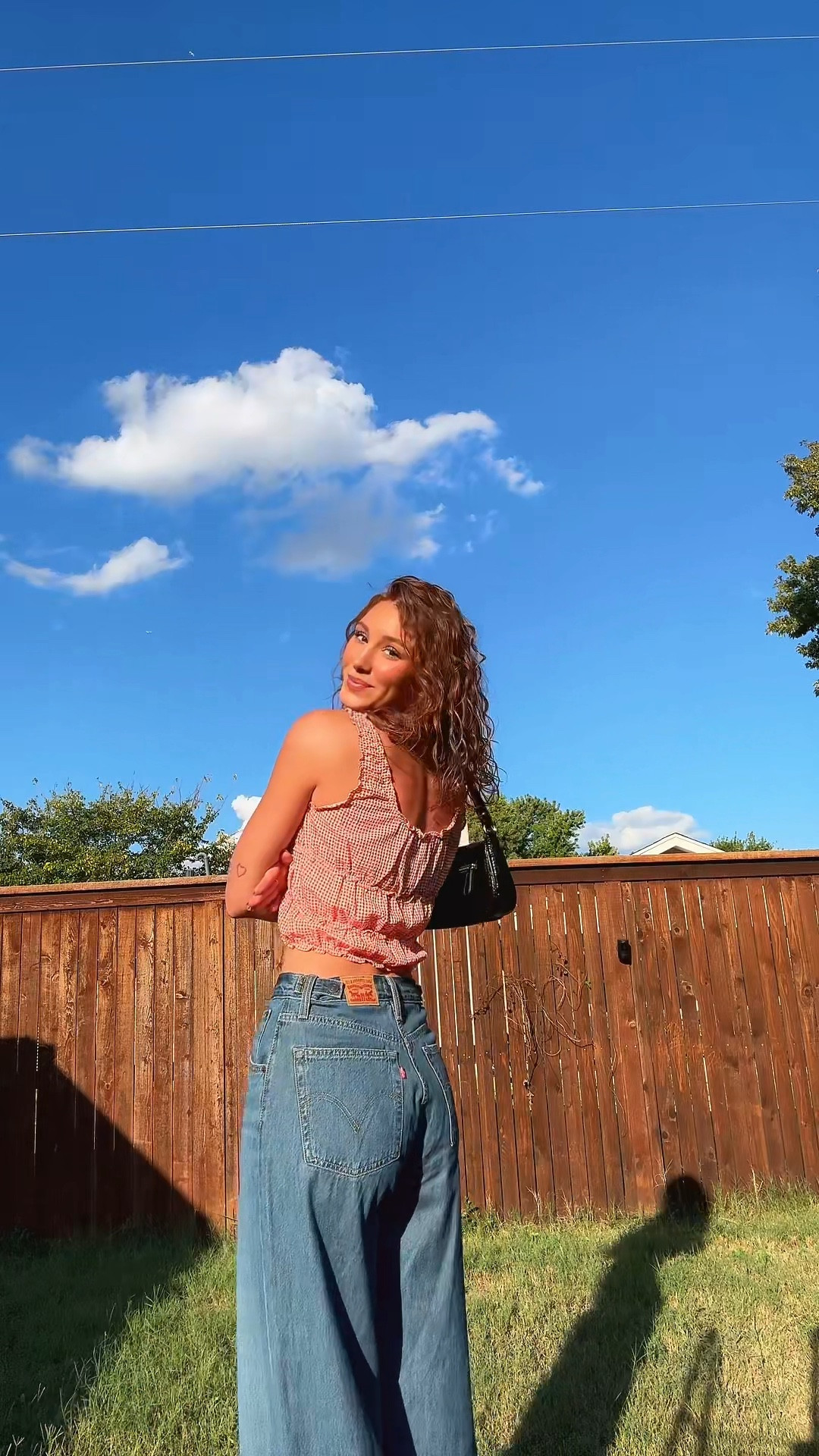 Obsessed with this girly gingham top + wide-leg denim combo 🤎 

#LTKTall #LTKSeasonal