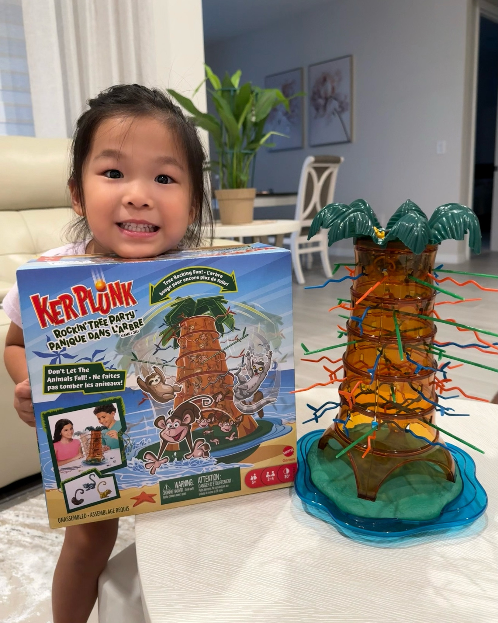 Added a new game to our game night stash! ✨ Attie is loving the KerPlunk Rockin’ Tree Party Game! It’s a classic revamped and with a fun twist for kids! Gameplay is to carefully pull out the sticks without letting the monkeys, sloth, and lemurs tumble down. This is so perfect for family time, playdates, or adding some giggles to the day. Video of gameplay coming soon! Attie got to play with mommy, daddy, and grandparents. We laughed so hard! 

⸻

Mattel Games, KerPlunk Rockin Tree Party Game, kids game night, family games, classic games for kids, fun family games, playdate ideas, family night favorites, toddler games, preschool games, easy games for kids, interactive games, kids activities, family fun ideas

#LTKKids #LTKFamily #LTKFindsUnder50