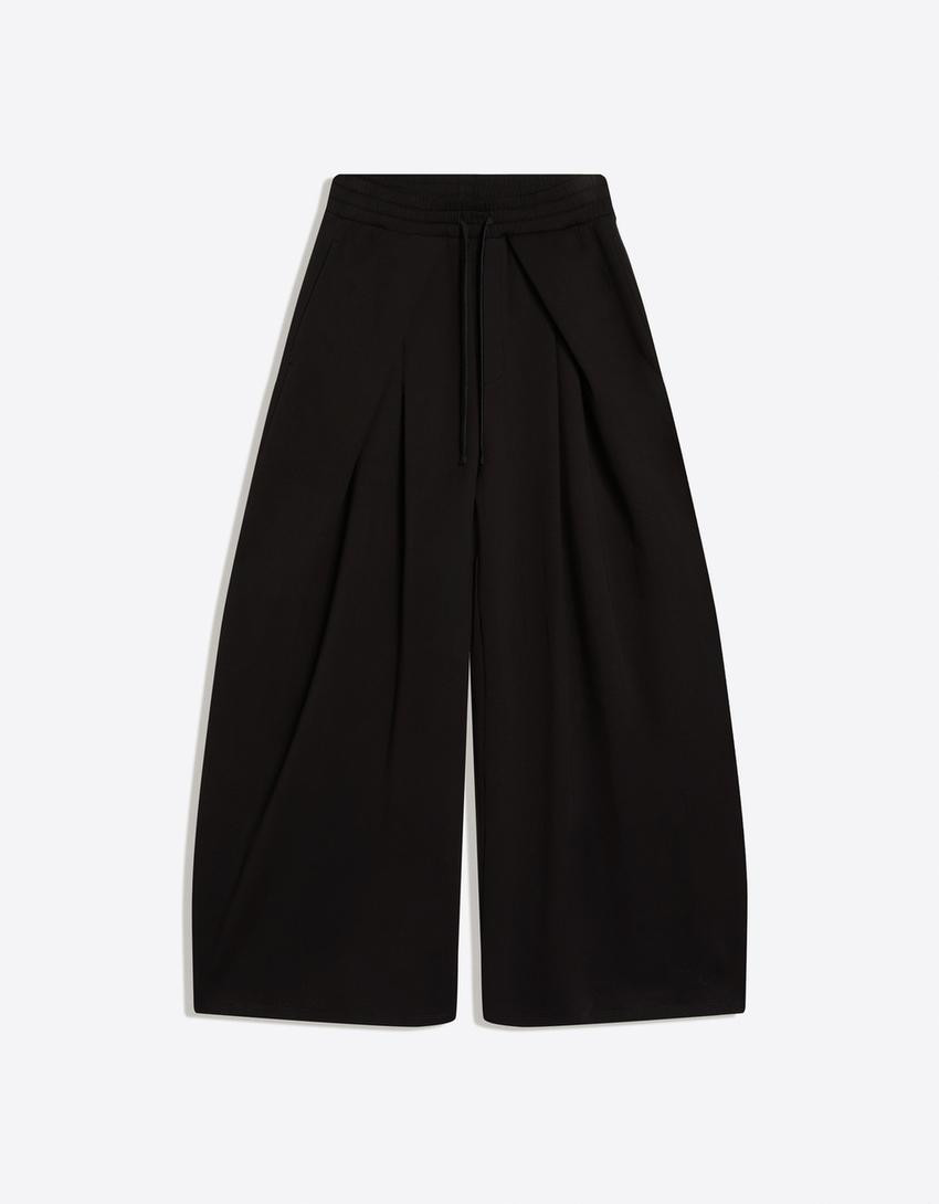 Neoprene effect wide-leg trousers with stoppers - Women | Bershka UK
