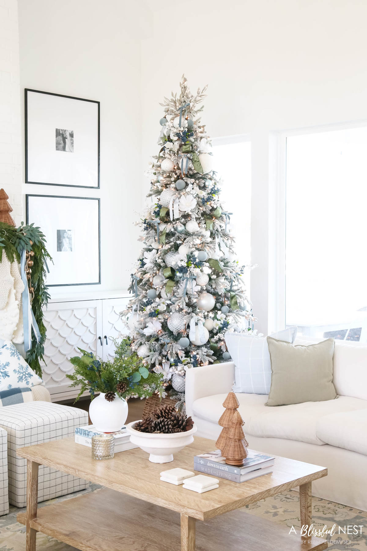 Simple, elegant, and full of Christmas charm from top to bottom. Grab the decor here.
knit Christmas stockings, Norfolk pine Christmas garland, dusty blue satin ribbon, ivory velvet ribbon, vintage cluster cow bells on rope, upholstered cube ottoman, fairy lights, blue berry greenery picks, cream textured throw pillow, baby blue matte Christmas ornaments, velvet Christmas balls, moss green velvet ribbon, dusty blue 2 inch wide satin ribbon, Natural Pine Cones, scented candles, sage green pillow 

 #LTKHoliday #LTKSeasonal #LTKHome