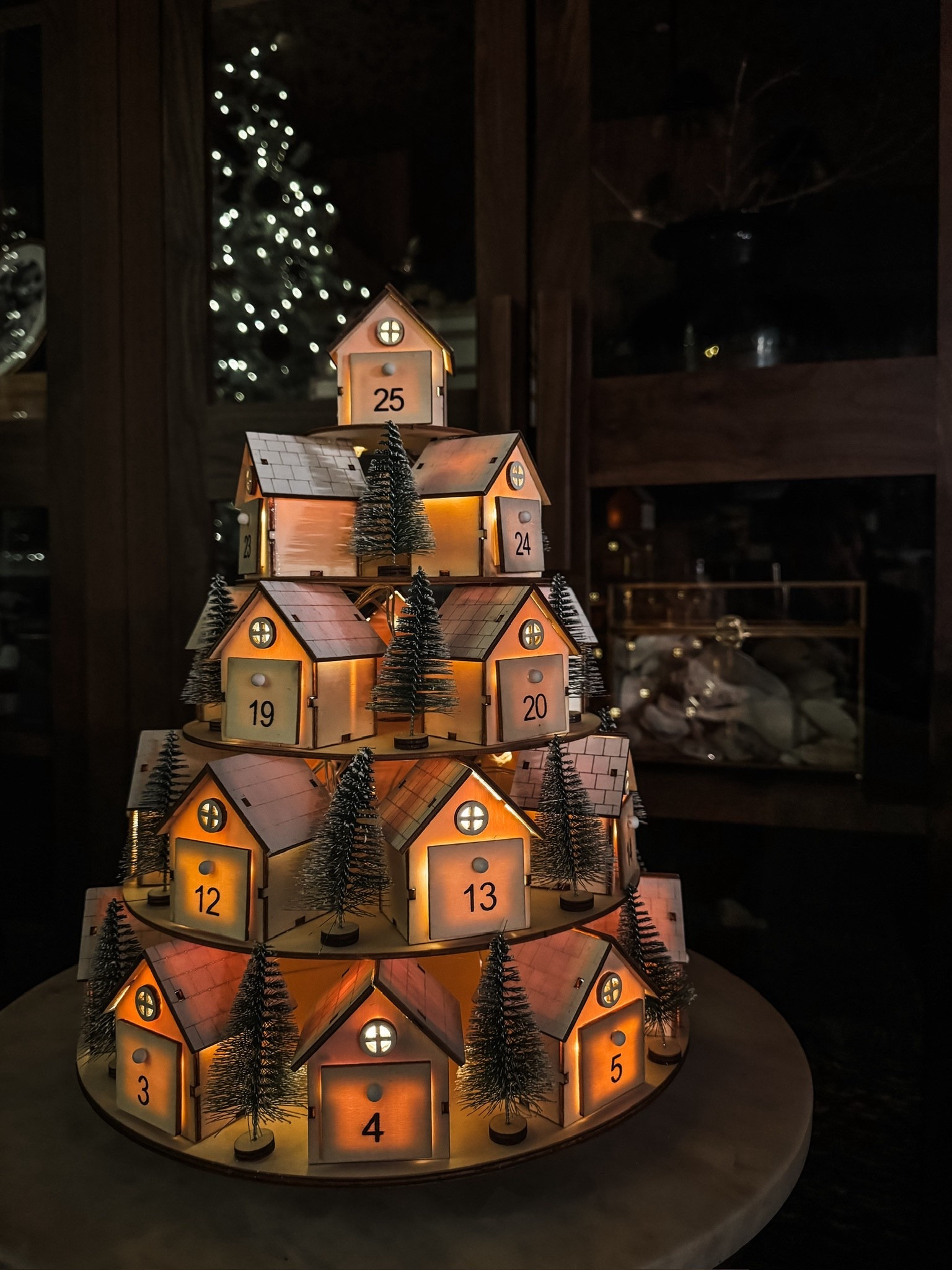 This illuminated Advent calendar village might be my favorite Christmas tradition yet ✨
Every tiny wooden house, numbered drawer, faux snow–topped roof, warm internal lights, and little bottle-brush trees creates the sweetest glow in the room. It feels like counting down to Christmas inside a tiny winter wonderland.
#eanesinteriors #adventcalendar #christmascountdown #holidaydecor #festivehome #christmasmagic



#LTKSeasonal #LTKHoliday #LTKHome