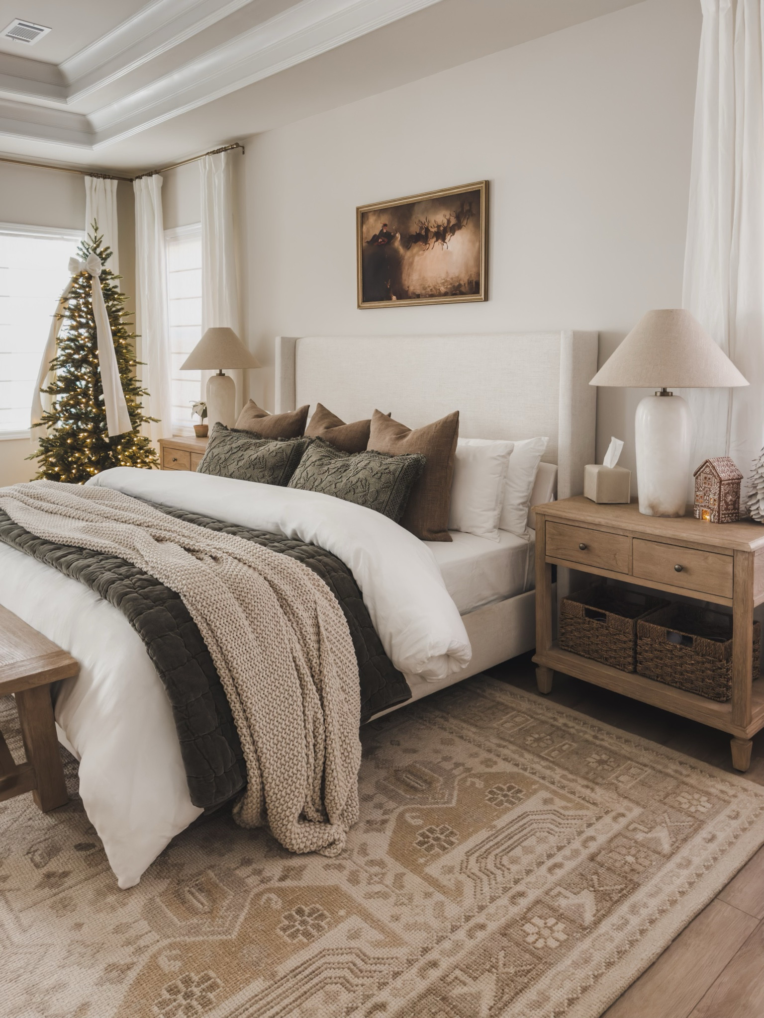 Primary bedroom holiday views featuring Pottery Barn! Cozy layered bedding combined with a touch of greenery for an inviting bedroom space.

Home finds, Pottery Barn style, bedroom refresh, cozy vibes, moody bedroom style, neutral wood tones, cozy bedding, nightstand faves, table lamp, faux tree, neutral area rug, neutral holiday home, digital art, gingerbread house, faux florals, woven basket, bedroom bench, upholstered linen bed, shop the look!

#LTKSeasonal #LTKHoliday #LTKHome
