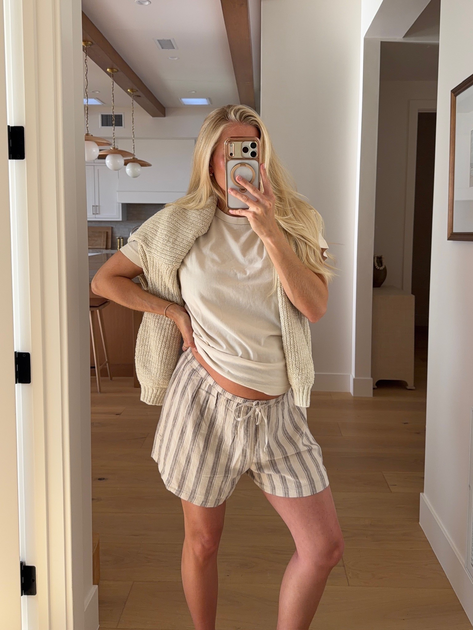 Wearing a small in tee (mens), medium in shorts (cream stripe - sized up for pregnancy), med in sweater (draped), code “KPGS20!” for discount on bracelet & ring! #kathleenpost

Spring outfits 2026, spring transition outfit, casual chic look, errands outfit, bump friendly, maternity look

#LTKBump #LTKootd #LTKSeasonal