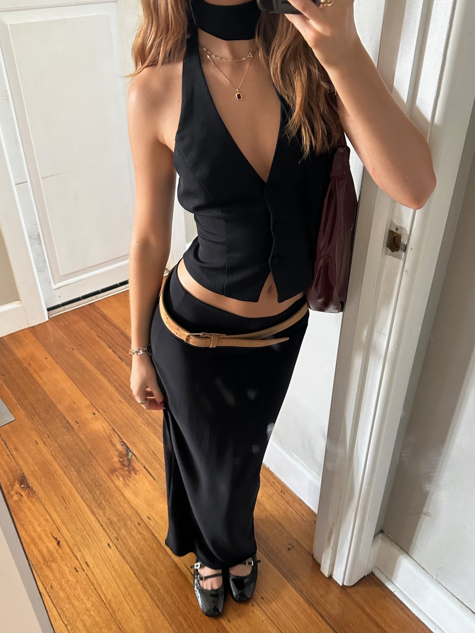Vest halter top, kookai vest, low rise maxi skirt, all black outfit, red shoulder bag, outfit inspo, Pinterest style, dinner attire, formal wear, work outfit ideas, fashion tips, styling tips, ootd, aesthetic fashion, halter neck top 

#LTKsummer #LTKaustralia #LTKworkwear