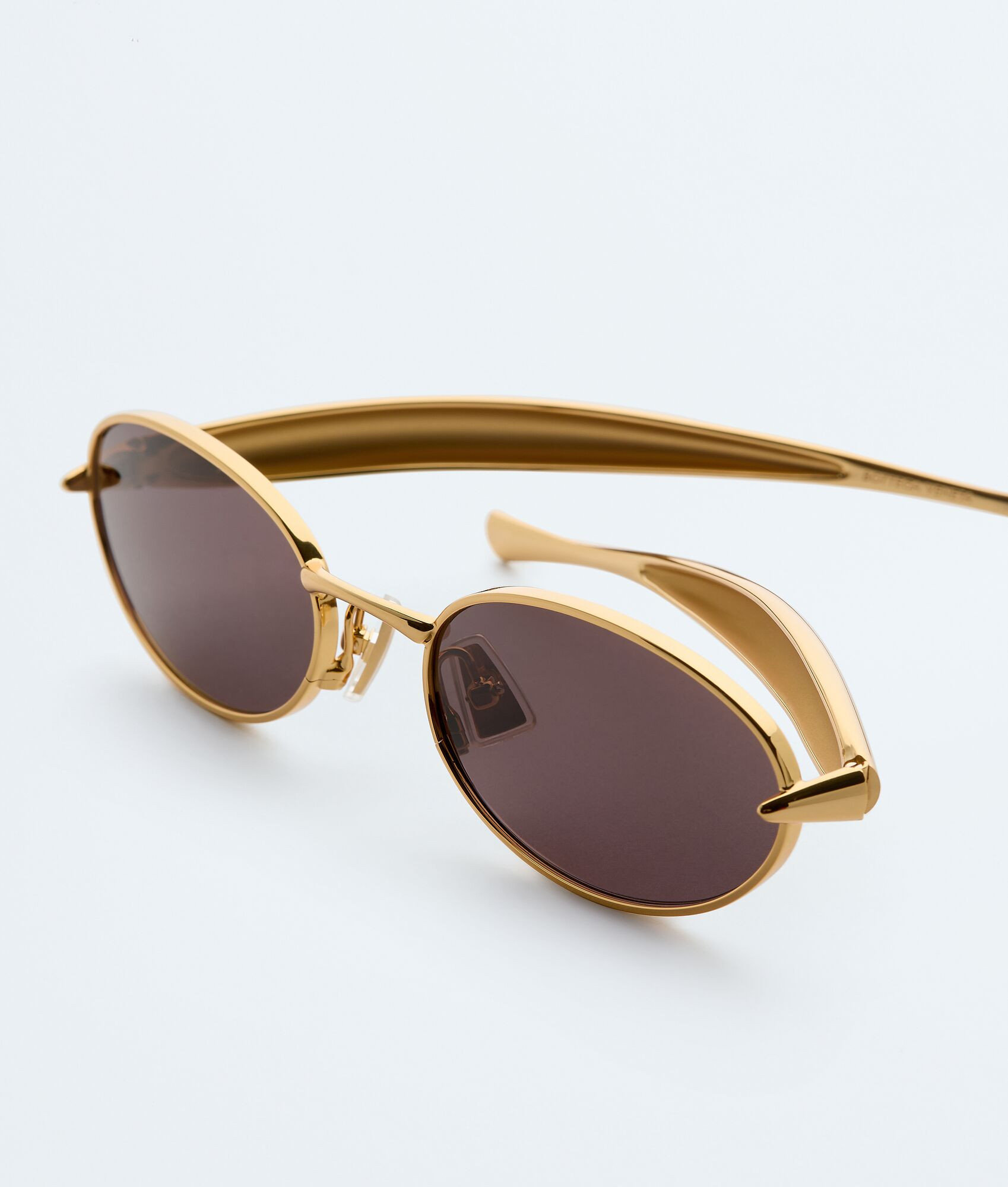 Sardine Oval Sunglasses in Gold/grey | Bottega Veneta US | Bottega Veneta