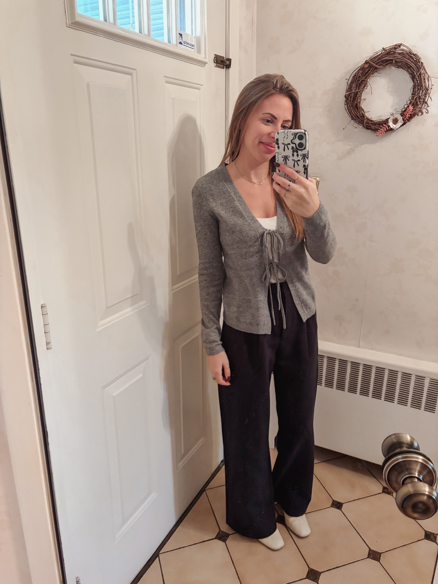 Front tie sweater from Loft 
Abercrombie trousers
Sam Edelman bootie 

#LTKSeasonal #LTKWorkwear #LTKGiftGuide