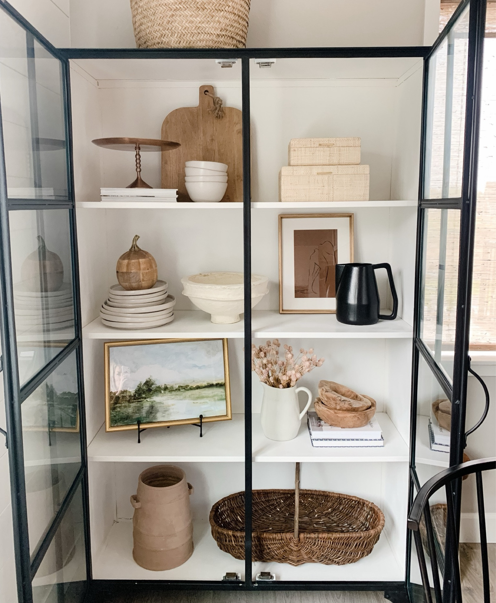 Cabinet styling! One easy way to change the look and feel of your space is by changing out your art. I have many affordable framed prints and sketches throughout our home from Target, and most of them are 20% off right now! Both of these art in stock and under $30! 

#LTKstyletip #LTKhome #LTKsalealert