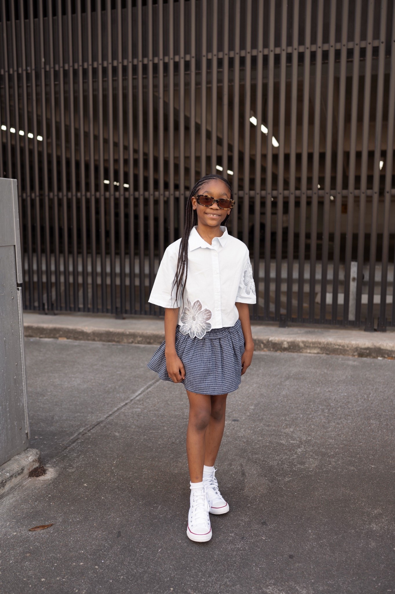 The cutest button down with flower detail, blue checkered skirt, converse high top sneakers, tortoise sunglasses - kids cute spring break outfit 

#LTKShoeCrush #LTKFamily #LTKKids