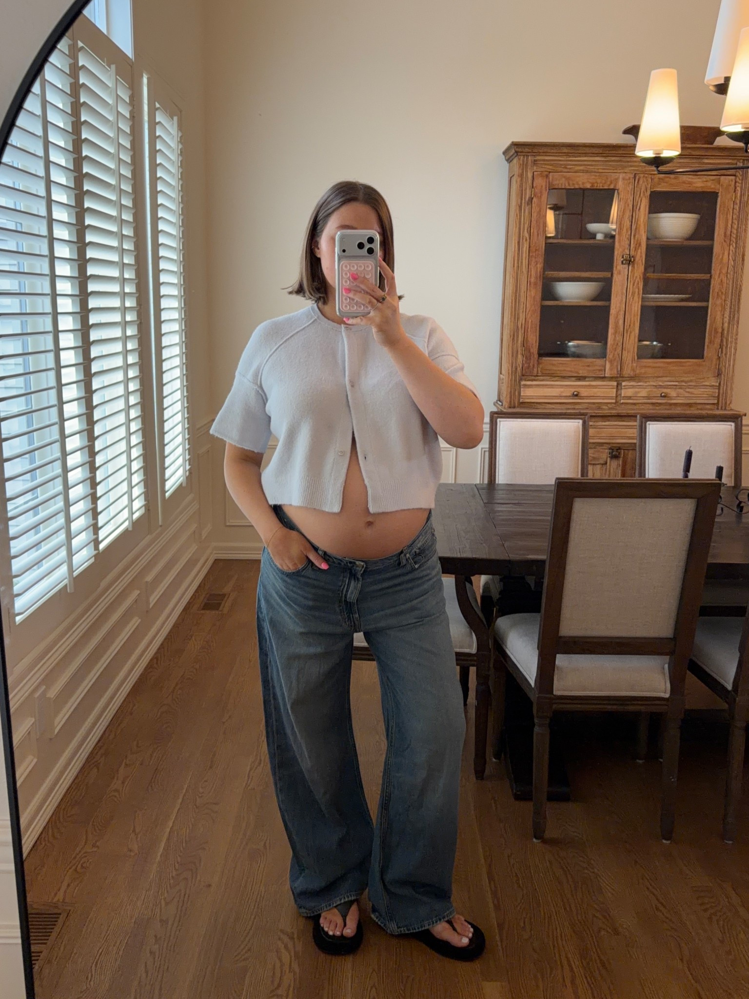 Size large in sweater from free people I love the pale blue. Wouldn’t be cropped much if I wasn’t pregnant so it’s very versatile! Madewell jeans are so good they have a stretchy rigid denim fit so flattering. I’m 20+ weeks and size 31 up two from my usual size but they have lots of room. Size down I think one size for a more accurate fit! 