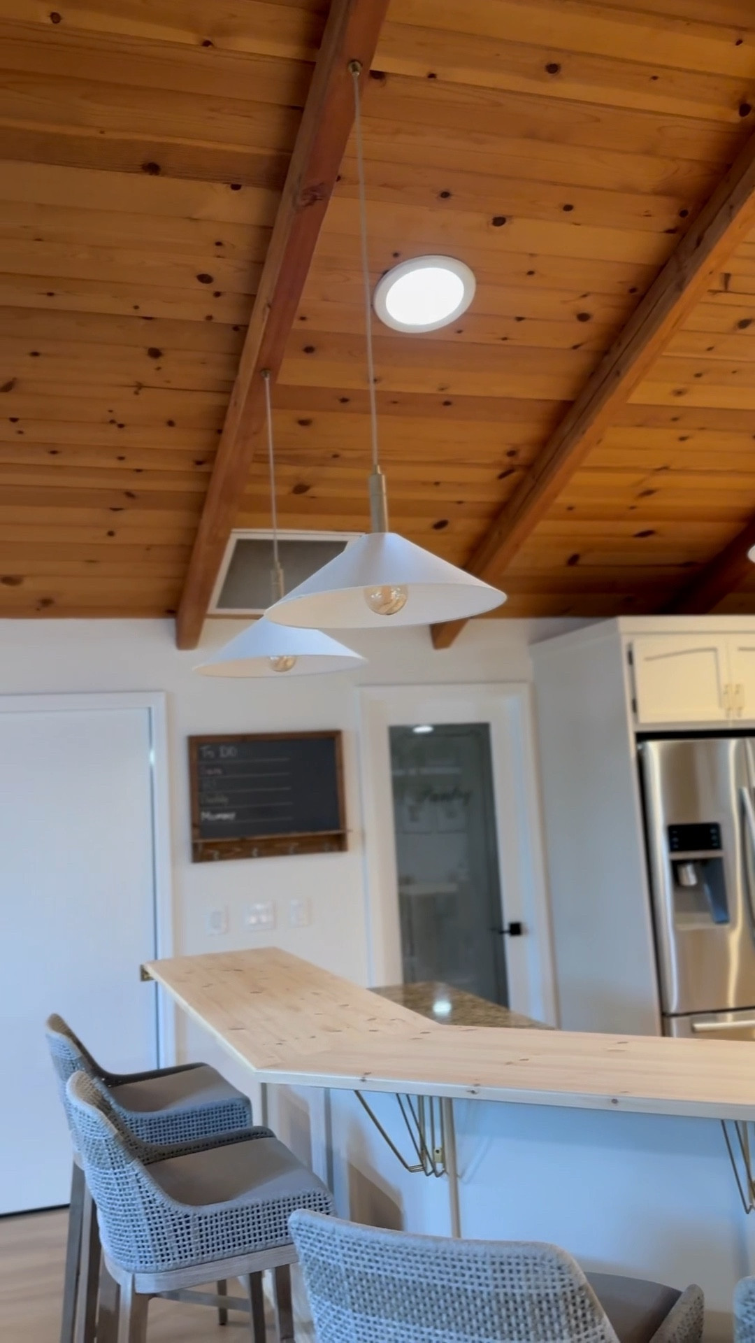 Light, airy, and inviting—modern pendants, luxe bar stools, and a custom butcher block island bring this farmhouse kitchen refresh to life. 

 

#LTKHome