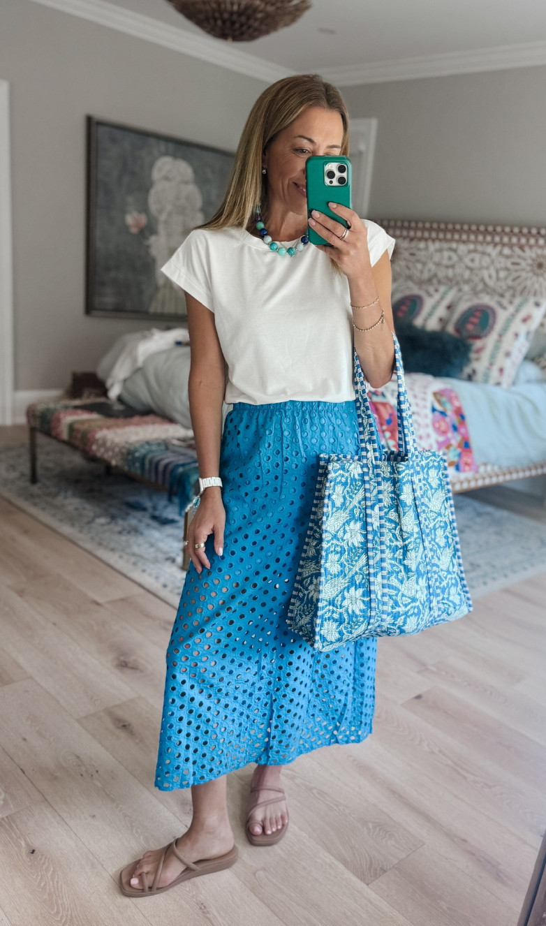 Proof that a simple white tee can still make an outfit feel chic 💙 The bright blue eyelet skirt, matching tote, and chunky beads give this look that fun vacation energy while still feeling completely wearable for real life. 

 #LTKgrwm #LTKootd #LTKmomlife