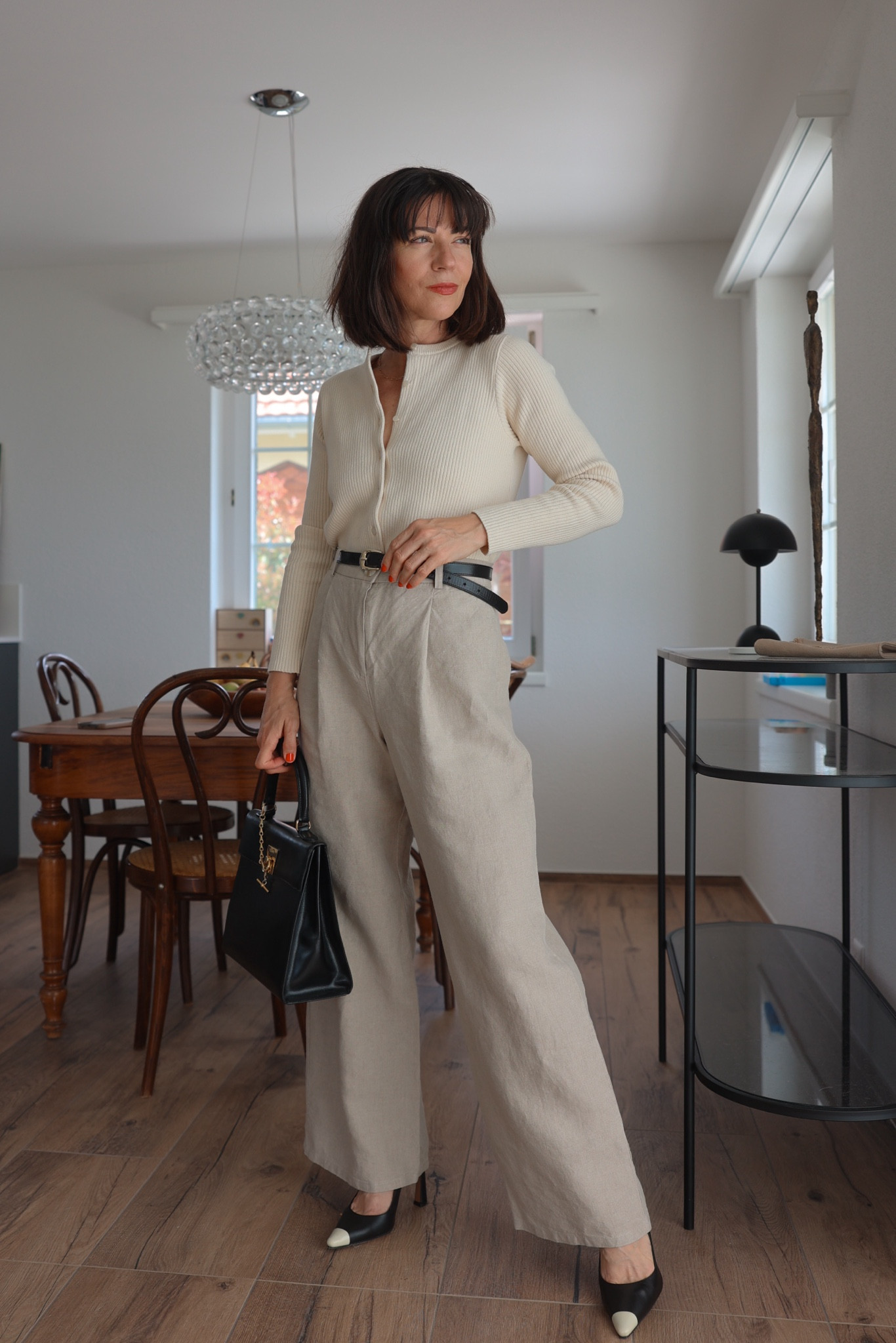 Simple but oh so chic. Got this beautiful Kylie cardigan from Sézane last week and it’s such a good piece. Versatile, feels so soft on the skin and can be worn in different ways - exactly the way I love my forever pieces. Open up the buttons on top or on the bottom or close all of them. Always looks a little different 🤍

Got size Small - at the moment this cardigan is only available in XXS and XXL anymore, the other sizes are sold out. I recommend to set an alert on the Sézane website to be informed when the cardigan is back in stock. Linked some similar ones, one from Everlane, almost same fabric composition but with deep v-neck. Reformation has a pretty similar one which is still in stock and the fabric is 92% organic cotton / 8% nylon.

Linen pants are from Naz, a Portuguese brand. They’re all about sustainability and craftsmanship and these pants are by a long run the absolute best linen trousers I have in my closet. Can’t link them here - will add the link to my April highlights on Instagram.

Shoes are Ángel Alarcón, bought them on Zalando here in Switzerland. Will try to find similar ones and link them. 

Bag is a Vintage Céline one. Will link similar ones for you. 

Belt is also Sézane, the Livie belt. 