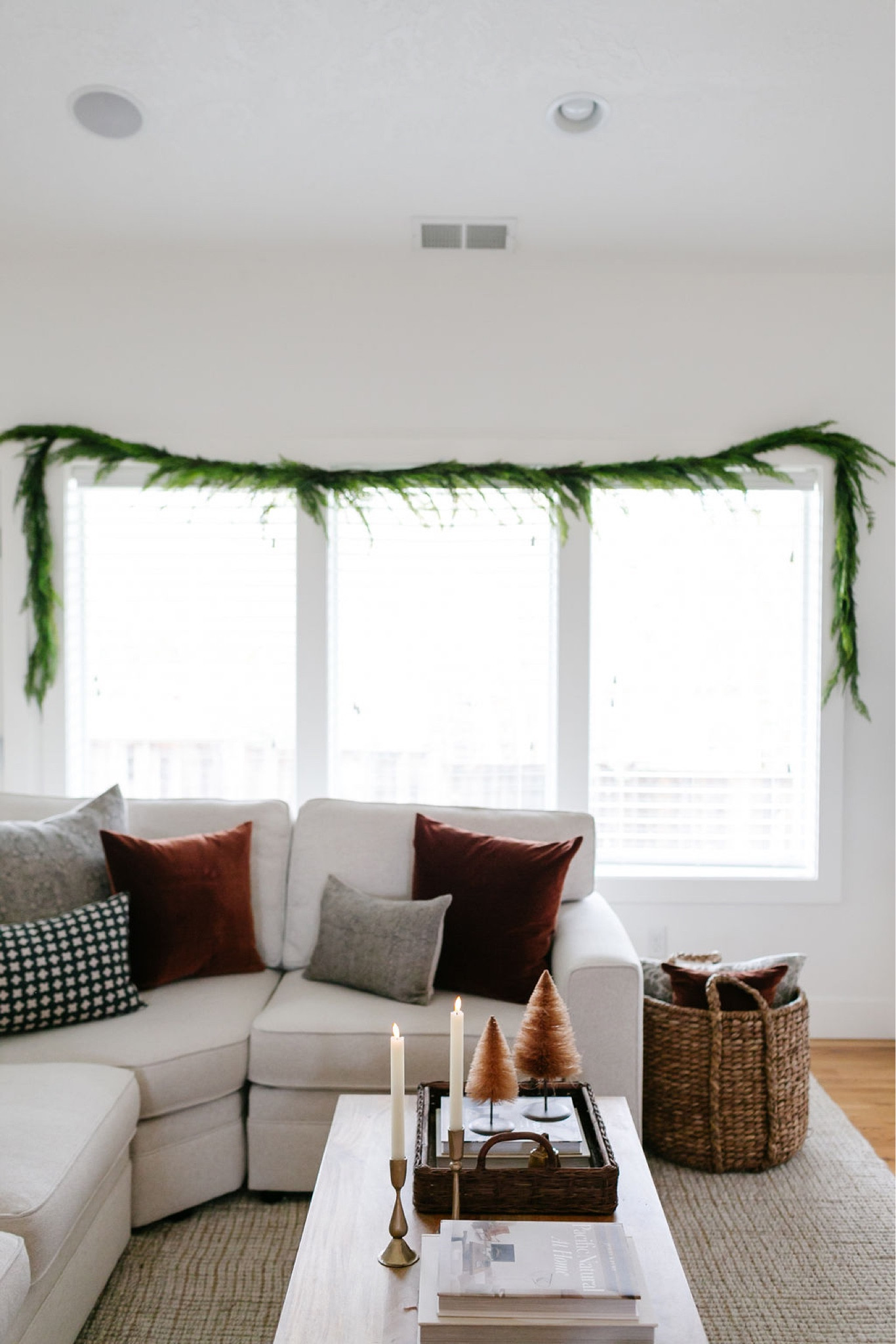 Garland, Christmas trees, Christmas decor, holiday decor, living room decor, coffee table decor, Pottery Barn wool jute rug, Pottery Barn sectional, Christmas throw pillows, faux garland 

#LTKSeasonal #LTKhome #LTKHoliday