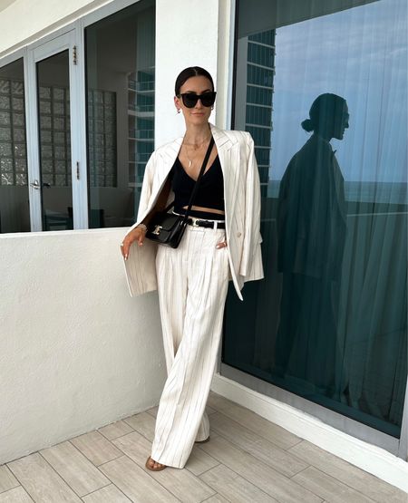 H&M pinstripe suit 
Fits oversized xs
Amazon knit tank Celine belt and bag and sunnies 

#LTKstyletip