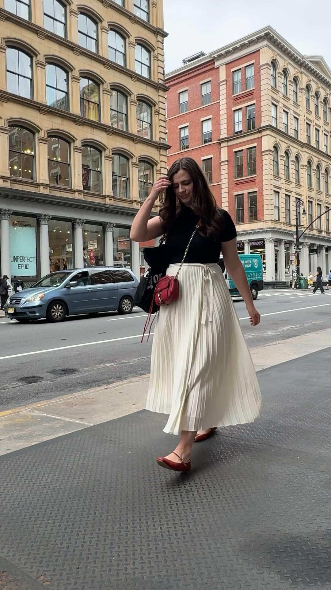 Black white and red outfit I wore out and about in NYC this week! I love this cream skirt from Sezané and paired it with a ribbed black top. The red purse and shoes are so fun!