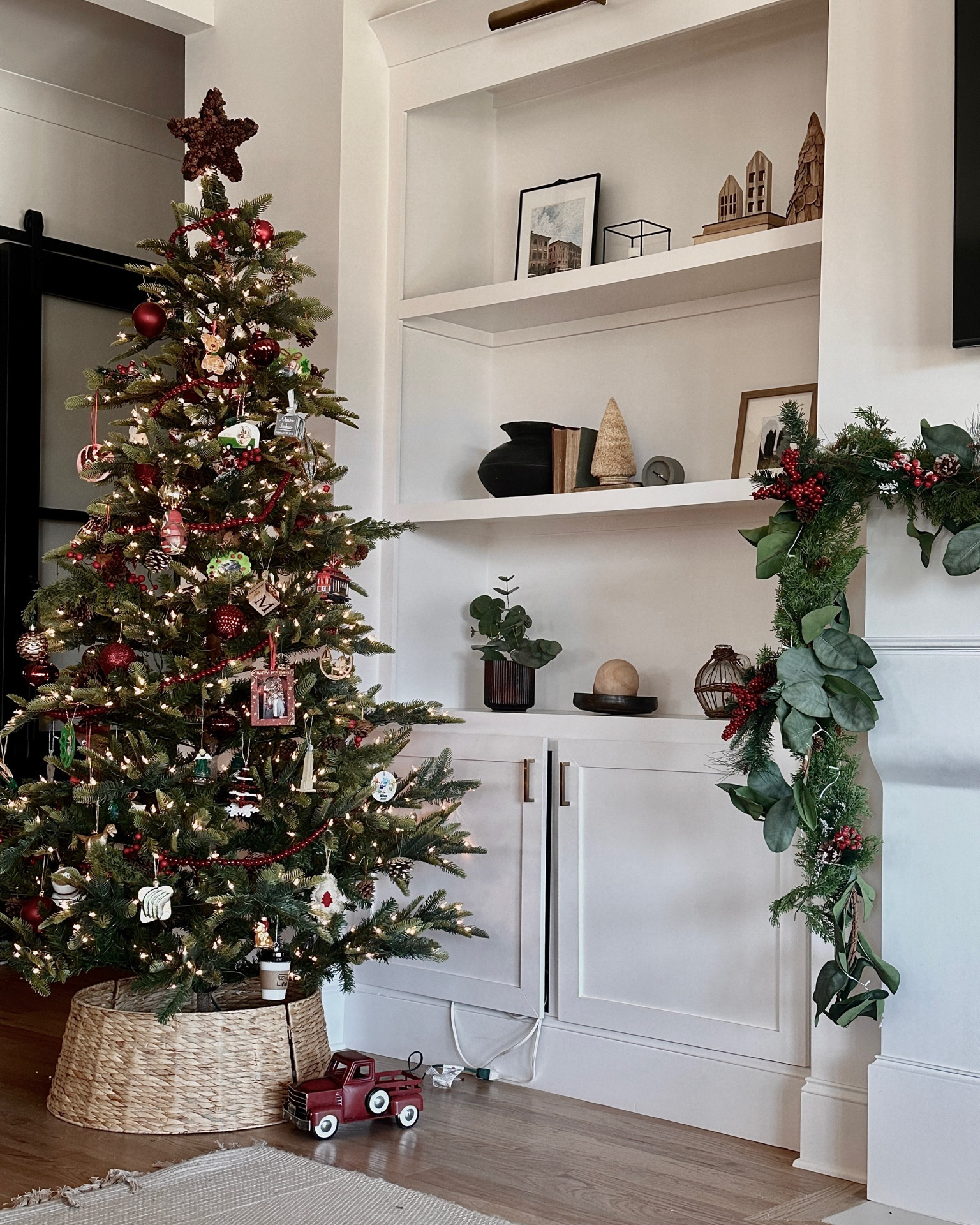 Another view of our beautiful faux Christmas tree! Prelit, 7.5’ tall and super realistic looking! We would buy it 10 times over, especially considering it’s under $300!! 

#LTKHome #LTKSeasonal #LTKHoliday