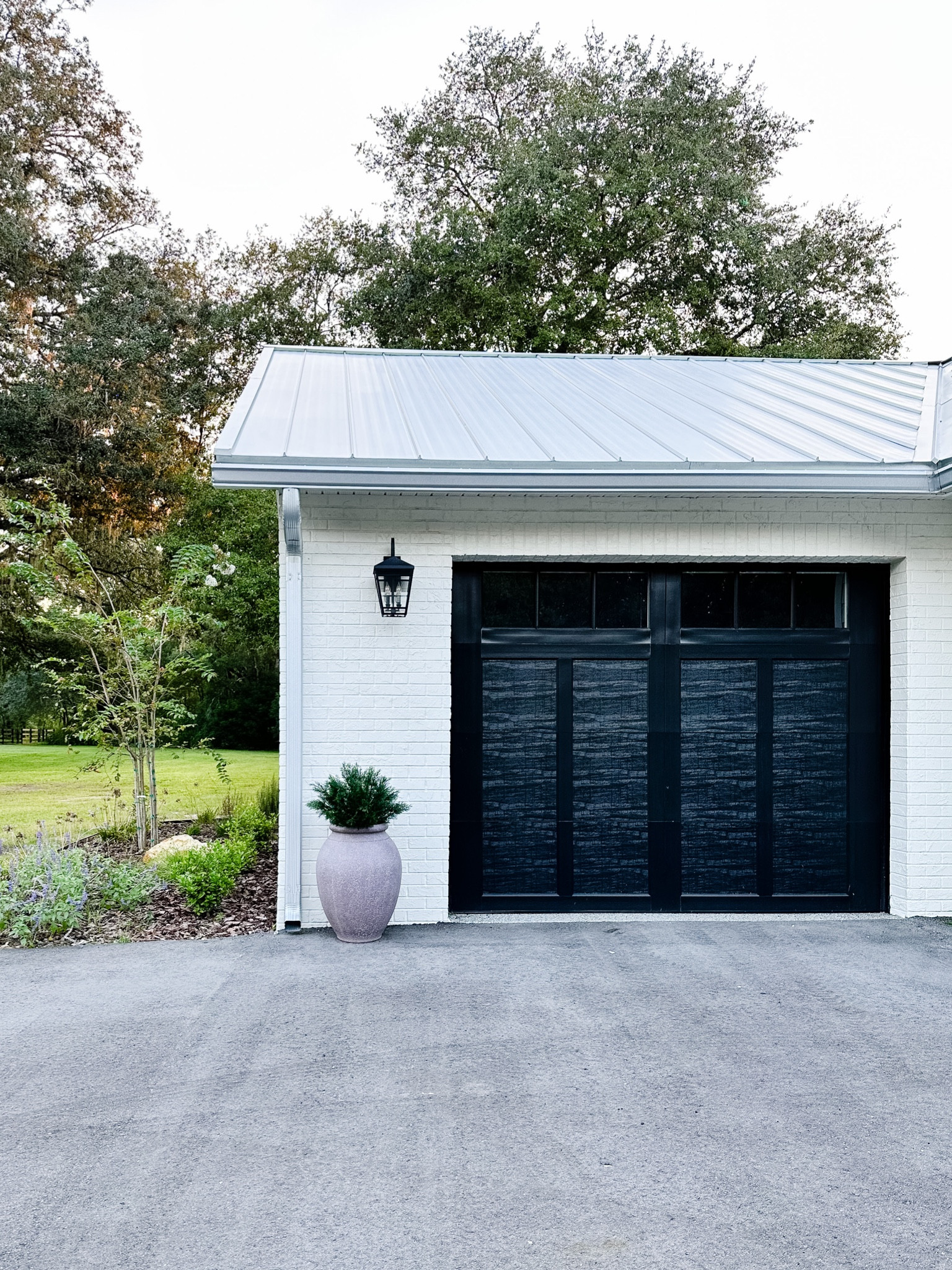 These large outdoor planters are splurge-worthy! They’re so great in front of our garage. I used a UV-rated outdoor plant on a plant stand inside the pots. 

#LTKhome