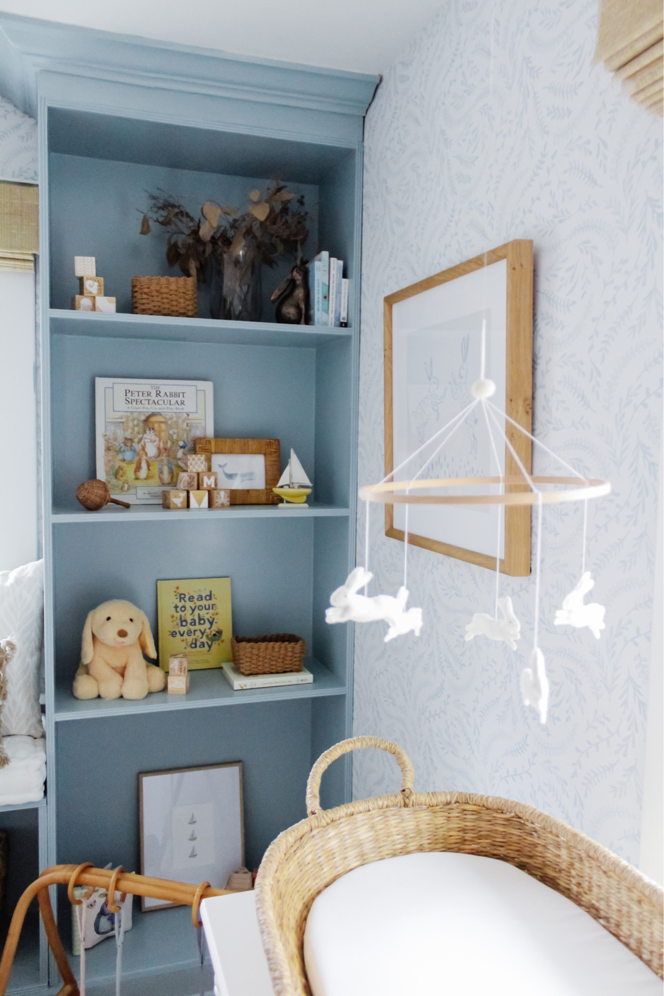 A moment of still amongst all we’ve got going on over here ✨ In case you missed it, this week brought a TON of updates - catch up over on stories!
•
Shop my home, read the blog, inquire about design services and much more via the link in bio. Message me with any questions!
•
•
•

baby nursery, blue wallpaper, white crib, glider, neutral loloi rug, soft rug, Roman shades, nursery design, nursery decor, woven hamper, crib skirt, gender neutral nursery, calm nursery, pouf, brass mirror, nursery shelf decor, changing table, woven changing basket, rabbit mobile, baby mobile, hutch
#nursery #nurserydecor #nurseryinspo #nurserydesign #nurseryinspiration #babyroomdecor #babyroom #neutralnursery #genderneutralnursery #homedecor #wallpaperwednesday #homedesign #potterybarn #glider #crib #maternityshoot #maternityphotography #ltkhump #ltkbaby 
#pregnancyannouncement 
#liketkit  

#LTKhome #LTKsalealert #LTKunder50