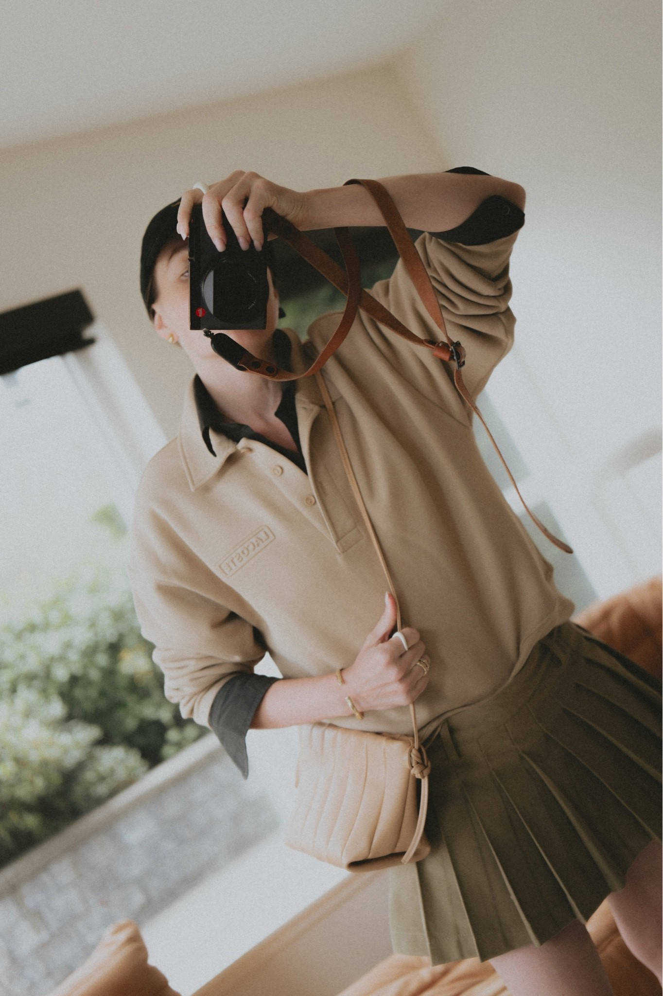 Mini skirt + polo sweatshirt over a button down shirt + mini bag + baseball hat
Polo shirt: Lacoste 🐊 
Shirt: Buck Mason
Bag: Maeden Boulevard 
Skirt: 7 for all mankind 
Hat: Polo Ralph Lauren

#LTKootd #LTKSeasonal #LTKWorkwear