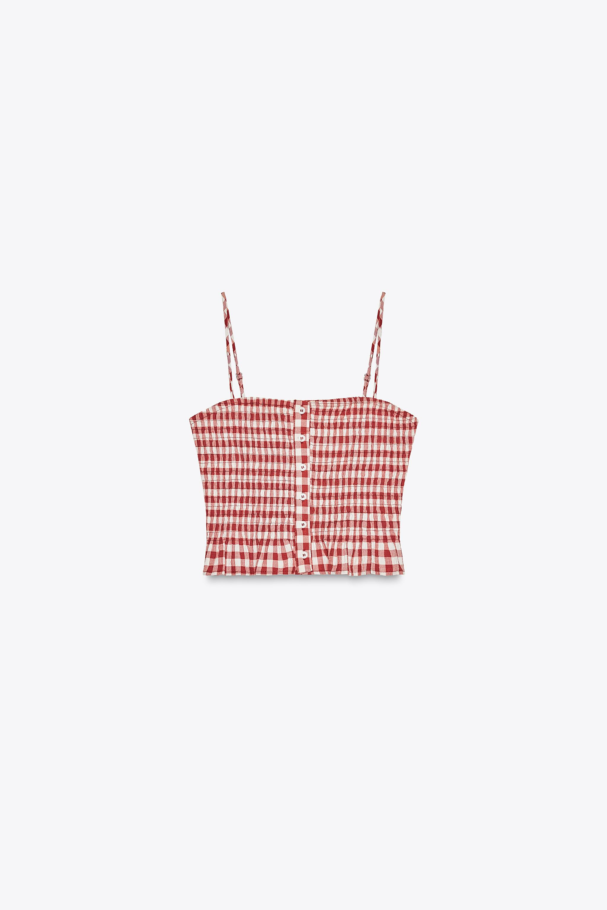 Crop top with a straight neckline and adjustable spaghetti straps. Smocked stretch fabric. Button... | Zara US