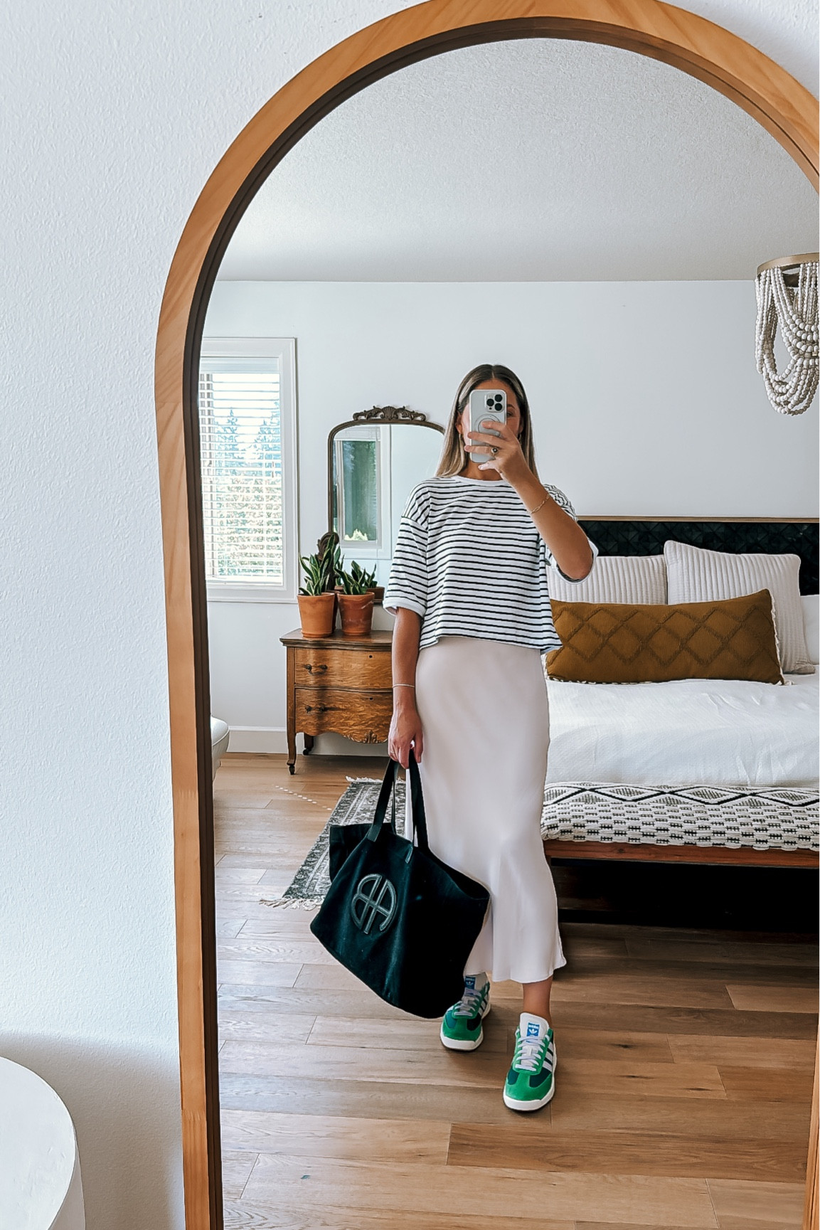 If you have a striped tee (such a good staple to have in your wardrobe) this is an easy outfit idea. Style it with a one color skirt and throw on some funky sneakers for a pop of color 💚🧡

#LTKSeasonal #LTKStyleTip #LTKShoeCrush