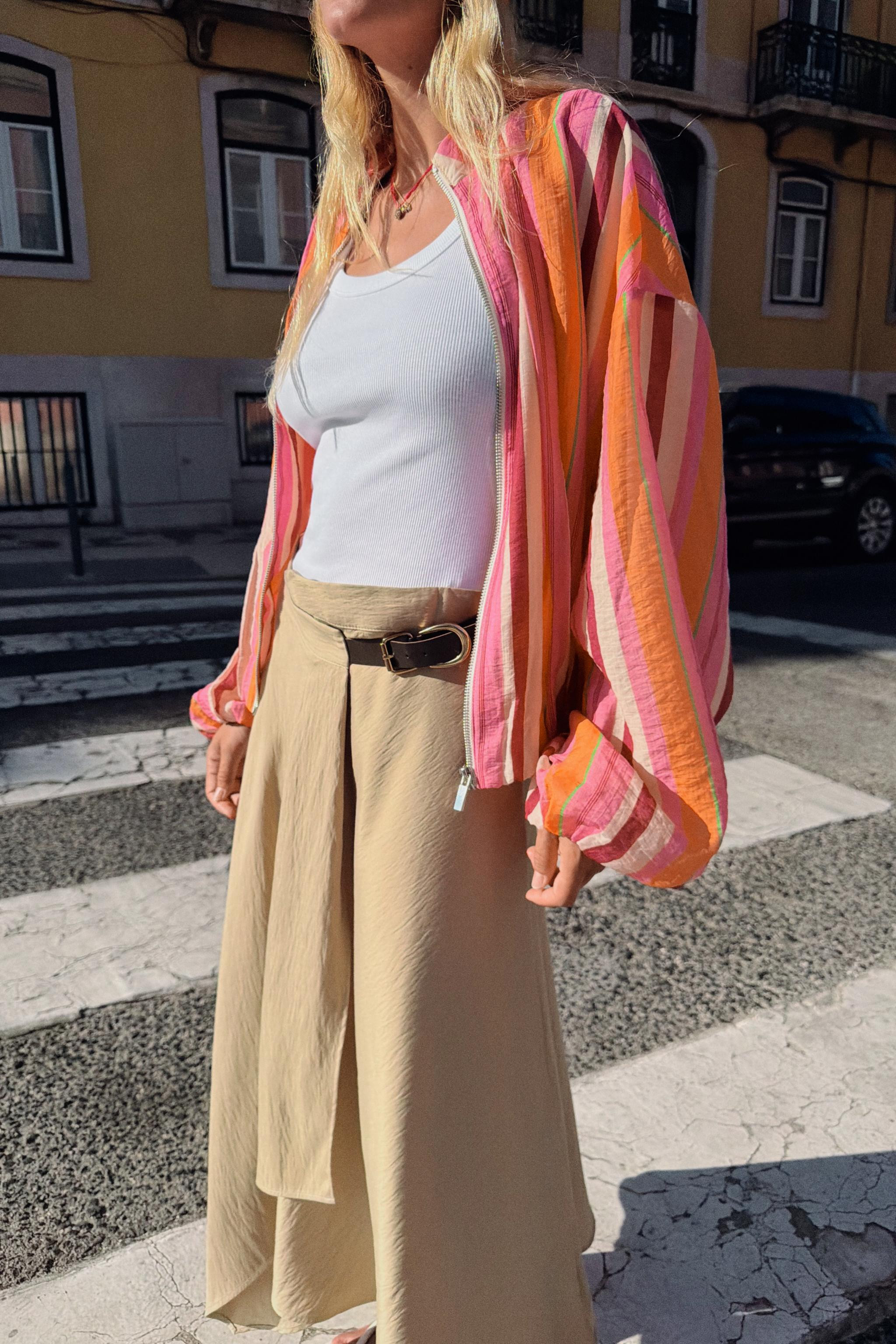 High collar jacket with long puffed sleeves. Hidden side in-seam pockets. Elastic trims. Front zi... | Zara US