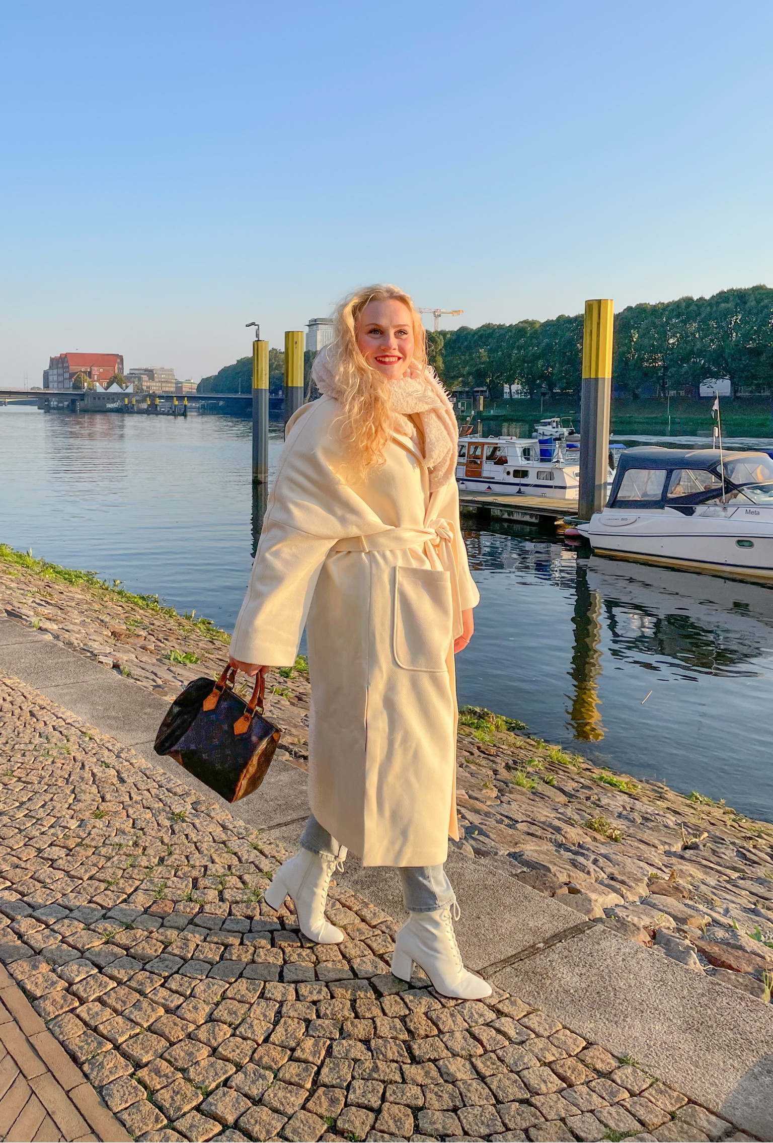 White coat with vintage Luis Vuitton speedy handbag and white heel boots 

#LTKstyletip #LTKworkwear #LTKfit