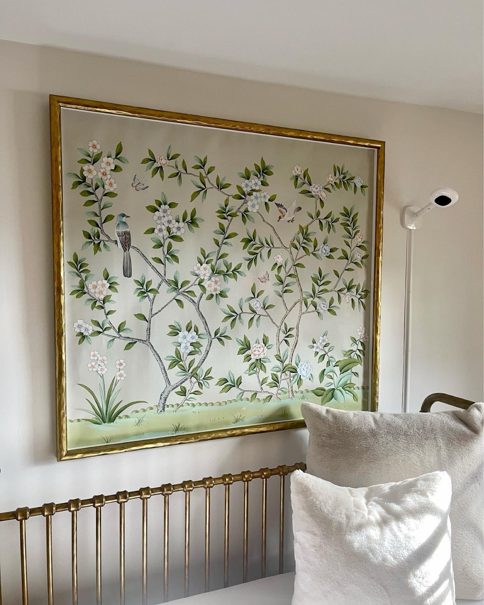 Absolutely obsessed with how this hand-painted chinoiserie on silk ground that was commissioned for over Sophia’s crib came out! 
•
The two birds (one pink + one blue) represents mama and dada always keeping a watchful eye over her while she sleeps. 
•
The finishing touch is the gilt frame with organic texture to match the brass crib below. 
•
Sweet dreams baby girl 🤍