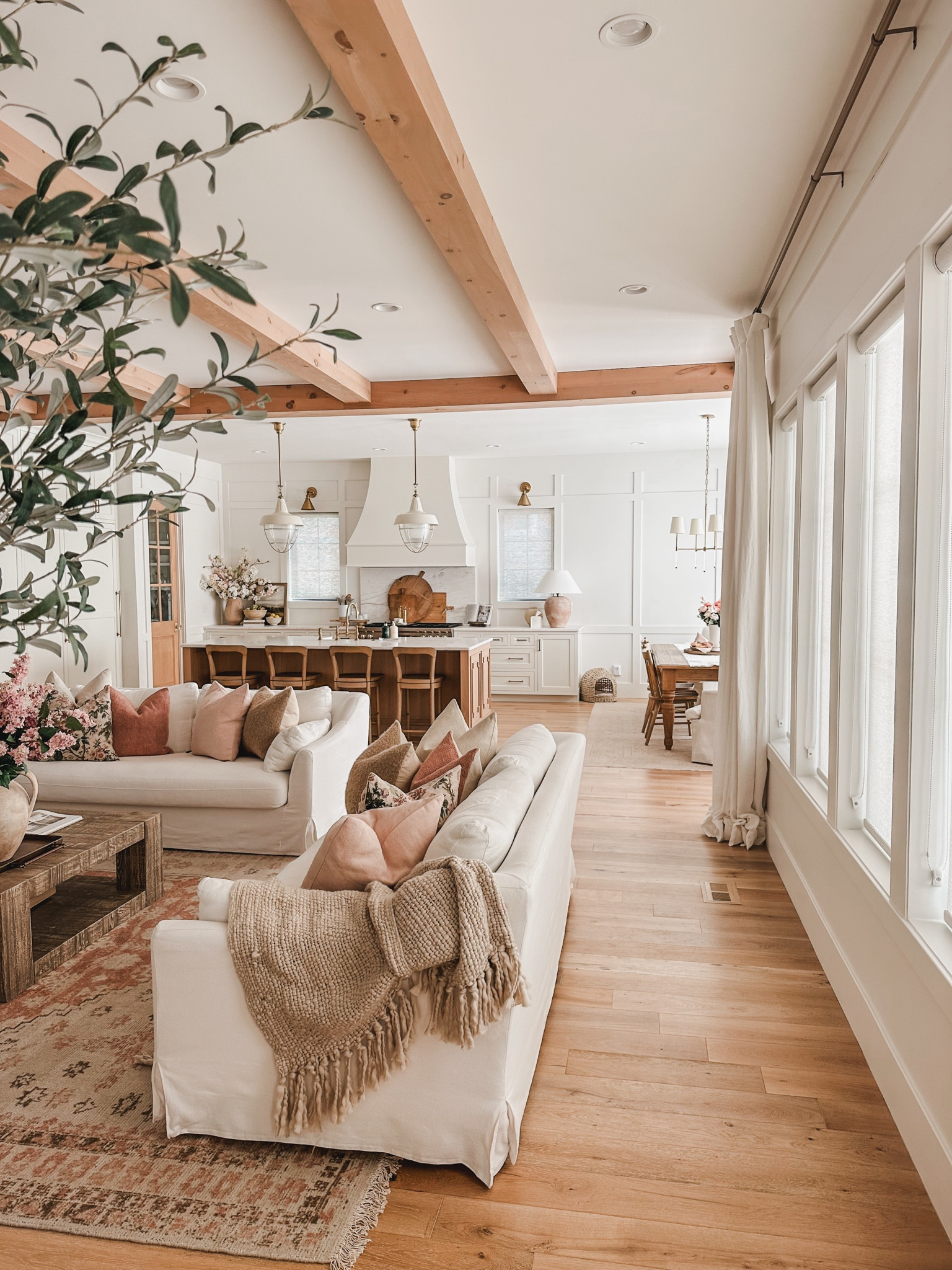 Create a serene and inviting living room with Pottery Barn! Light and airy summer refresh featuring neutral wood tones, textured seasonal pillows and incorporating a stylish faux olive tree 

Living room refresh, summer refresh, Pottery Barn style, neutral wood tones, pops of pink, creamy whites, neutral area rug, coffee table finds, furniture favorites, faux florals, throw pillow, accent chair, curtain detail, living room views, light and bright, coffee table decor, throw blanket, neutral home, aesthetic finds, faux olive tree, shop the look!

#LTKSeasonal #LTKStyleTip #LTKHome