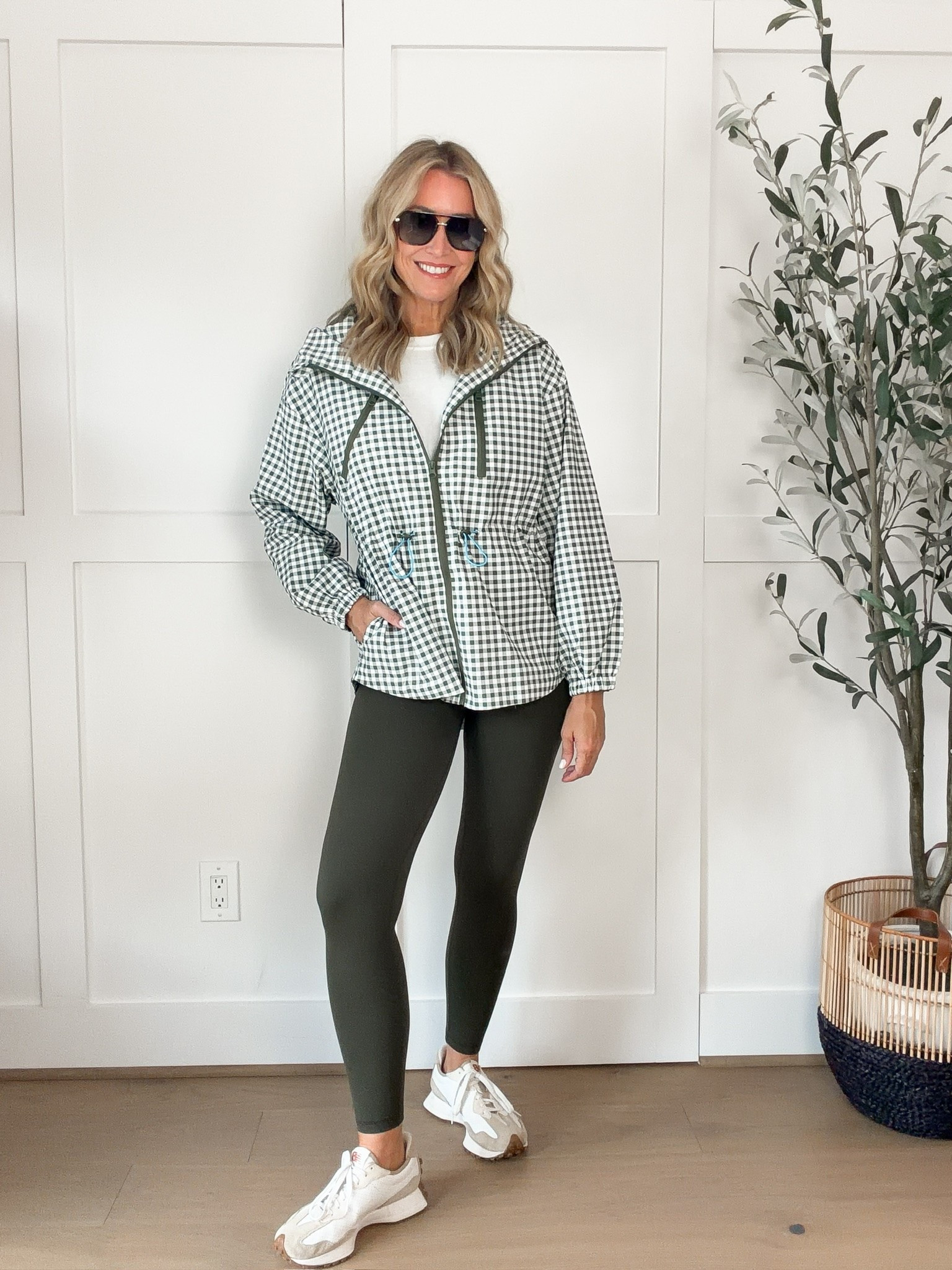 This gingham jacket is such a fun way to make leggings feel like an actual outfit. The structured hooded layer adds interest to a simple white tee and leggings, while the neutral sneakers keep it practical for running around all day.

gingham jacket, gingham print jacket, leggings outfit, casual fall outfit, athleisure outfit, white tee outfit, fall layering, neutral sneakers, everyday fall style, comfortable outfit, women’s fall fashion, HauteandHumid