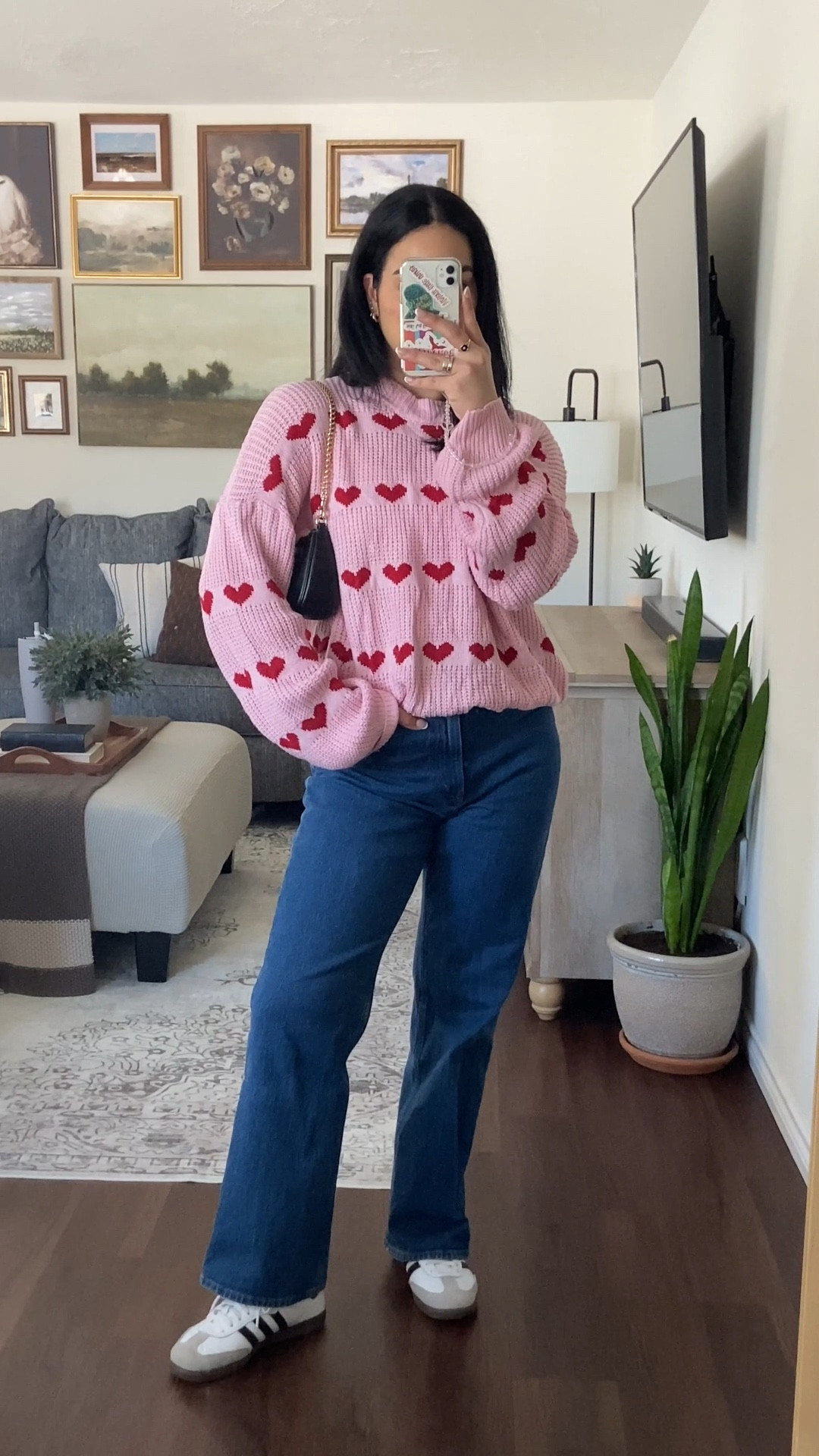 nail day vlog 💅🏼 outfit details: wearing this pink sweater with red hearts in a size large for a roomy fit & wearing the jeans in a 28. 

#LTKMostLoved #LTKWatchNow #LTKStyleTip