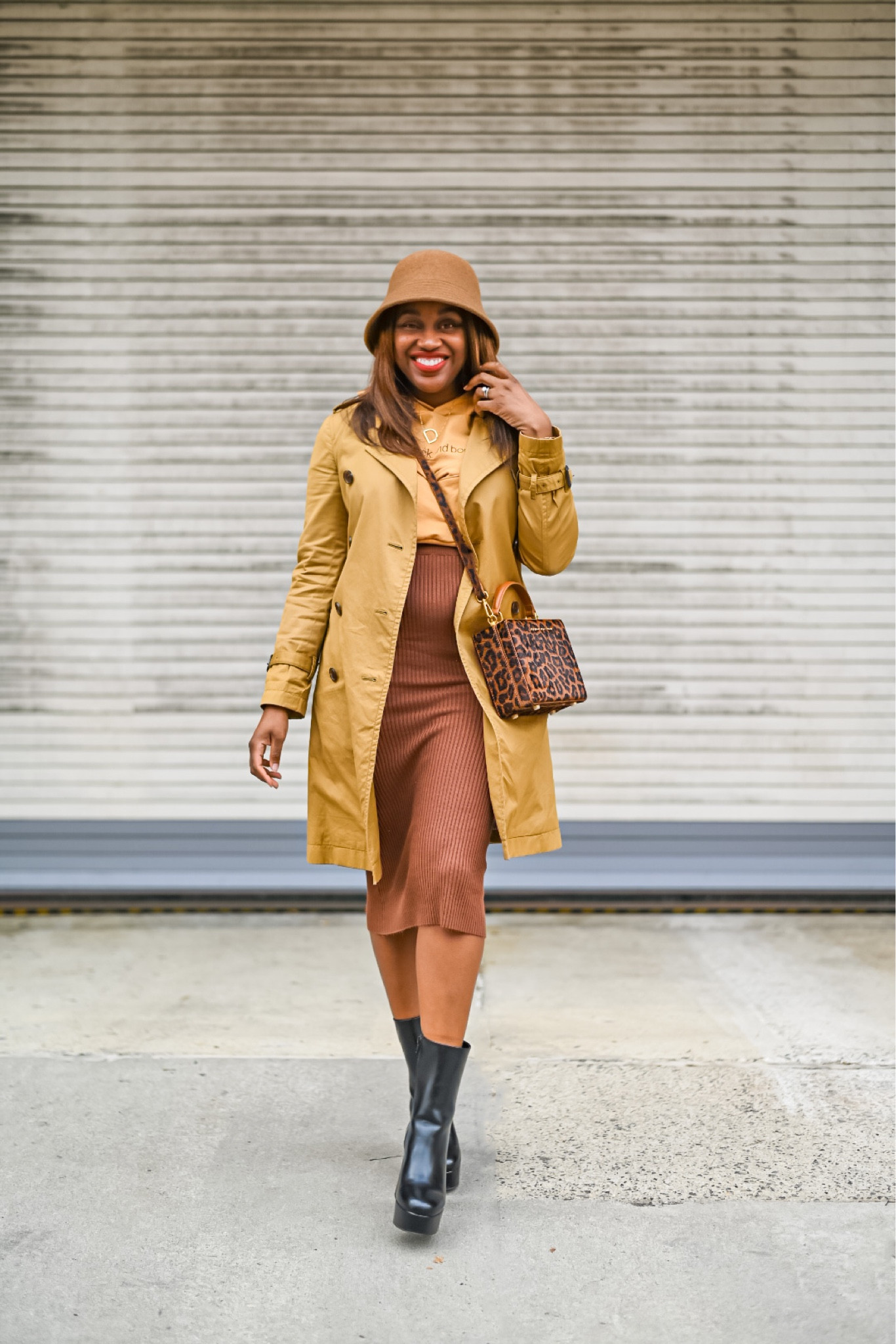 Spring outfit idea - trench coat, crop hoodie, midi skirt, platform boots and bucket hat. 

Loved wearing this out because not only is it chic, but it was so comfortable. 🤎