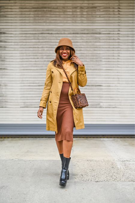 Spring outfit idea - trench coat, crop hoodie, midi skirt, platform boots and bucket hat. 

Loved wearing this out because not only is it chic, but it was so comfortable. 🤎