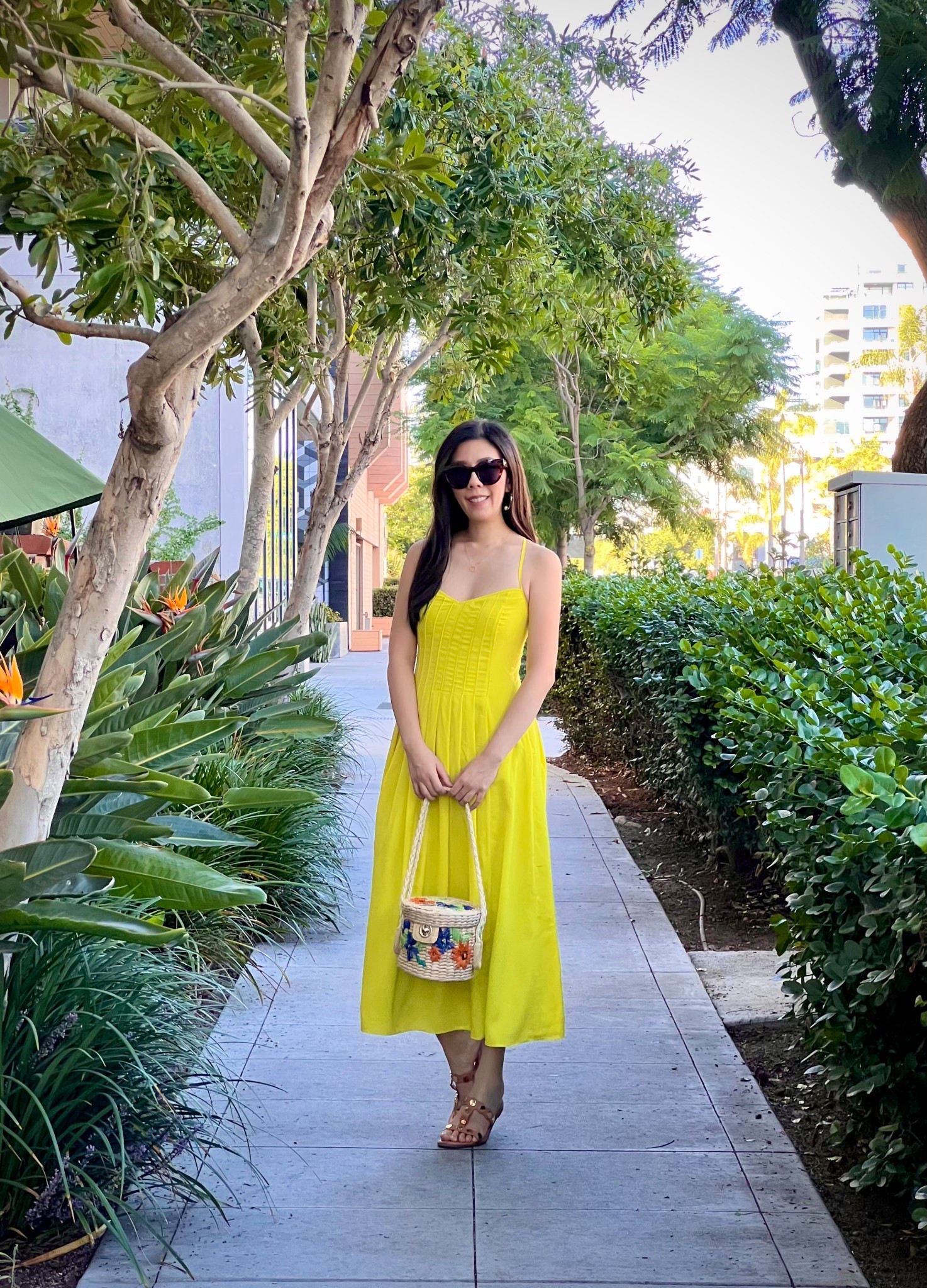 Summery weather calls for strappy dresses in bold colors! I love this bright highlighter yellow midi dress that moves with even the slightest breeze! I’ve worn this so many times and I even took it on my trip to Santorini. I paired this with my cat eye sunnies, gold sandals, and straw bag. #springstyle #mididress #petitestyle

#LTKPetite #LTKItBag #LTKFindsUnder100