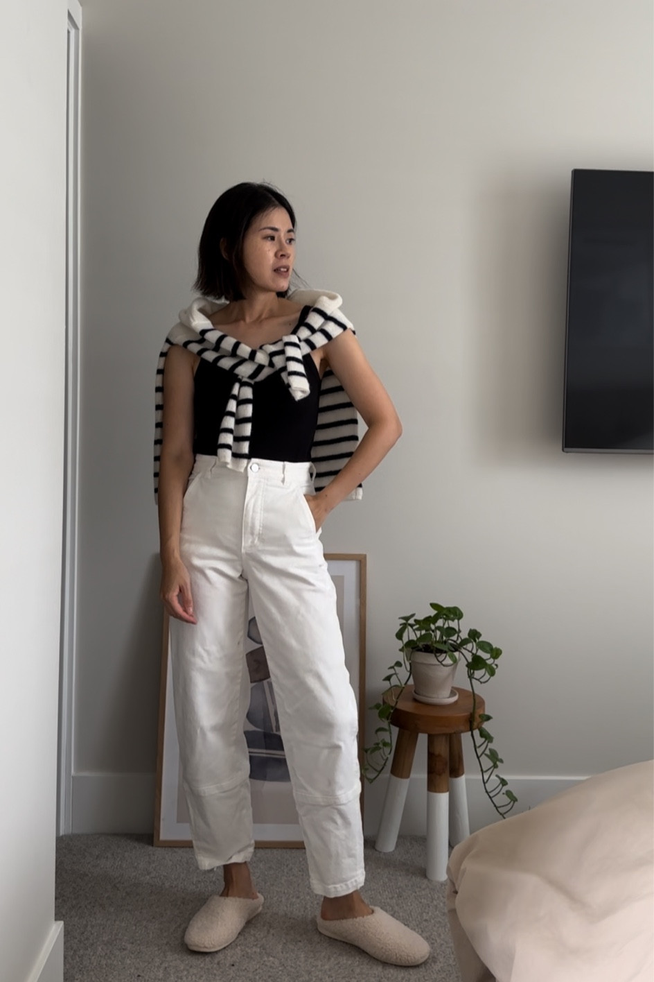 Tank: Reformation. Tts
Sweater: Sezane Gaspard Cardigan. Runs a bit large. I’m in xs
Pants: Everlane Utility Barrel Pants. These do stretch. I sized down
Slippers: Everlane old