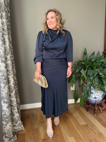 Dress under $60. Comes in many different colors. I’m wearing the navy. Size XL

My spanx shapewear is the real deal. I can wear it most of the day. I like that I can wear my own bra. But I’ll link one that is also a built in bra. I wear an XL. Use my code NANETTEXSPANX for 10% off and free shipping. 

My purse is a clutch or also has a chain strap. Linking similar fabulous shoes  

#LTKfindsunder100 #LTKover40 #LTKwedding