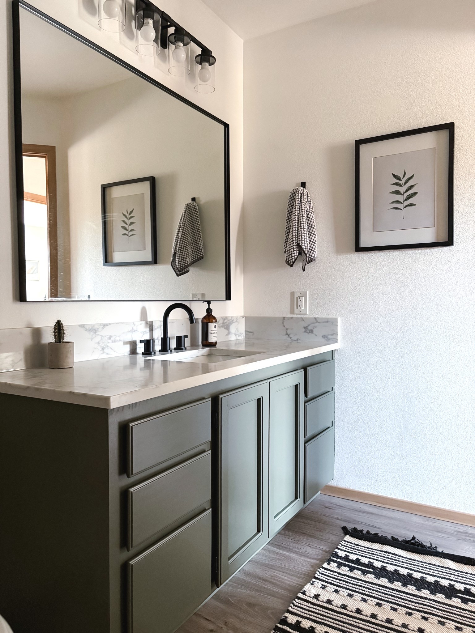 These olive green Cabinets really stole the show in this bathroom makeover! Easy DIY projects with a super big impact- including vanity, light mirror, painted cabinets, faucet and neutral decor for an organic modern aesthetic

#LTKHome