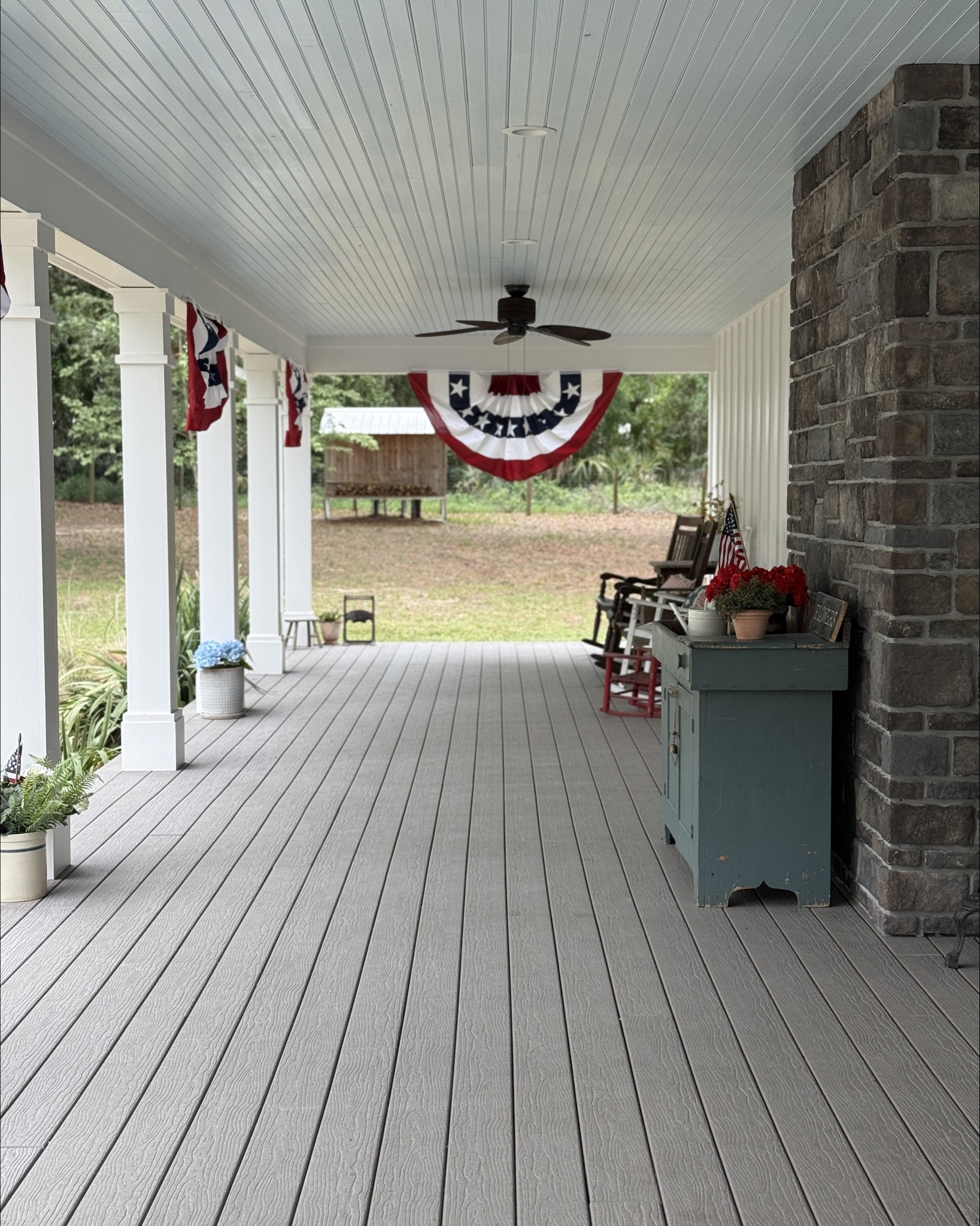 Patriotic Porch Decor - What better way to celebrate summer than with old glory both in the home and on the porch. I love using flag buntings, pillows, faux (real touch) flowers and more! 

#LTKSummerEdit #LTKSeasonal #LTKHome