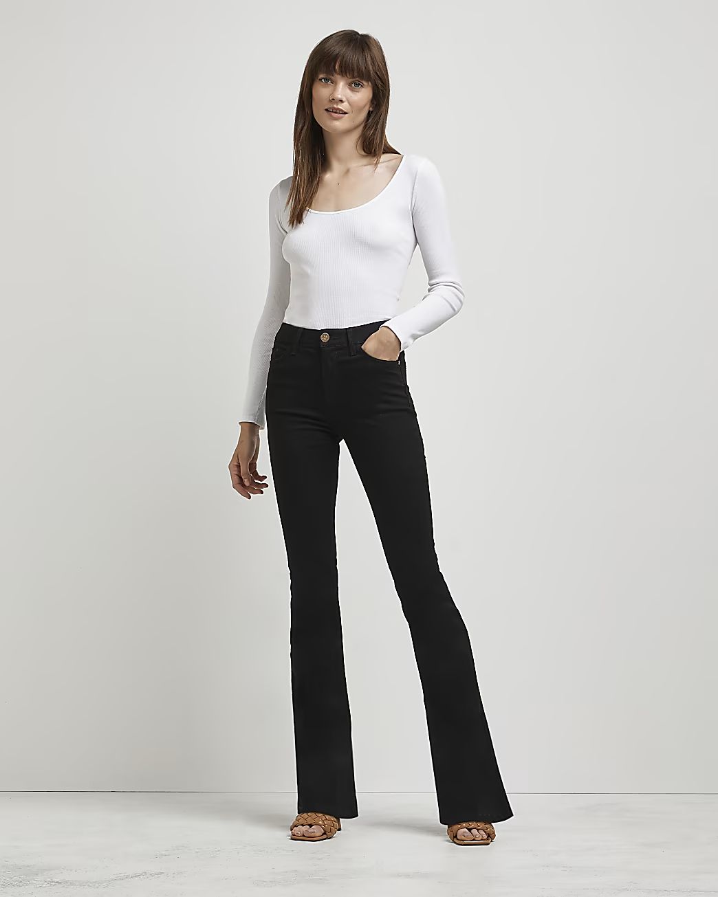 Black mid rise flared jeans | River Island (UK & IE)