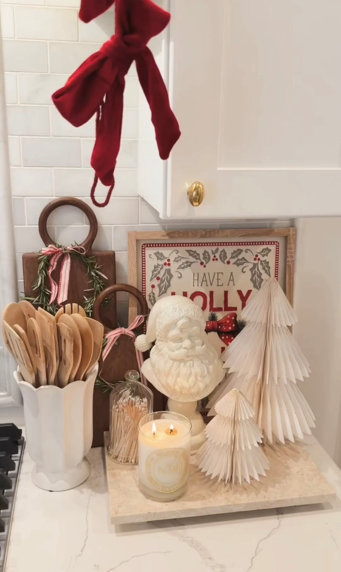 Christmas kitchen corner with Santa bust, little Christmas tree and cutting board