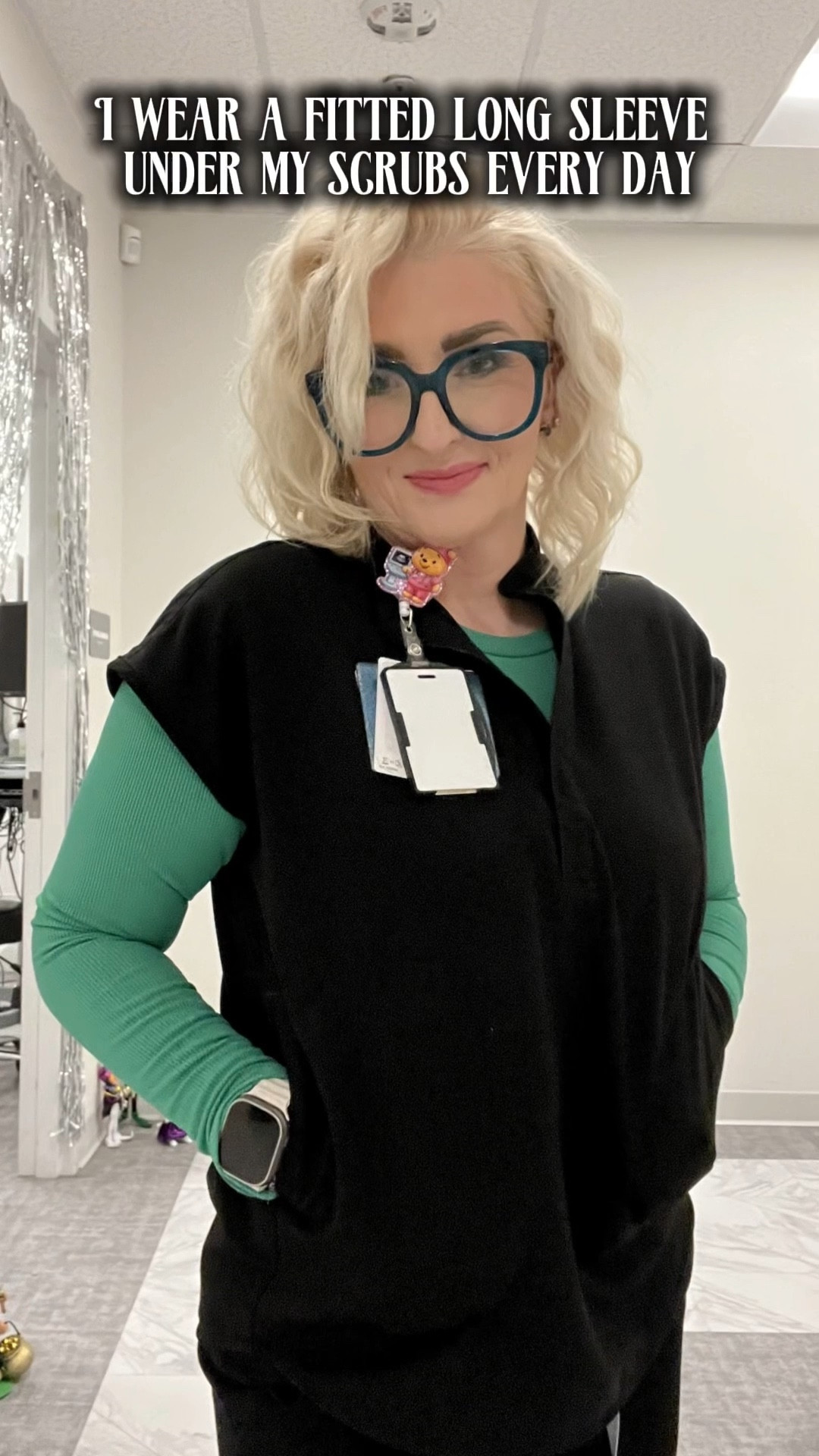 Clinics and hospitals are always freezing.

I wear a fitted long sleeve under my scrubs almost every day and sometimes add a pop of color.

Linking the Amazon underscrub here.