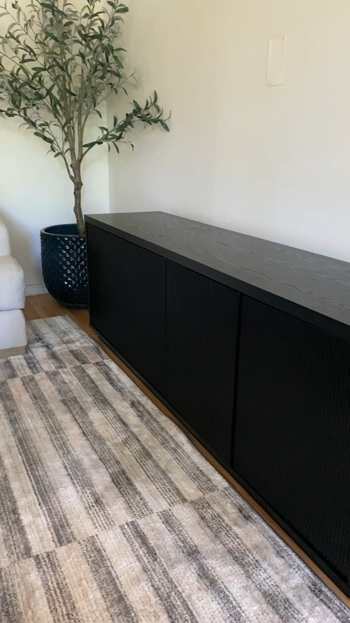 70” black wood grain media console tv stand with magnetic push to open/close gorgeous fluted 4 doors (no hardware needed). On sale for Amazon Prime Day for a fraction of the lookalike prices! 🖤

*A lot of assembly is required but I did it myself 38 weeks pregnant and it was so worth it! 

#LTKHome #LTKxPrimeDay