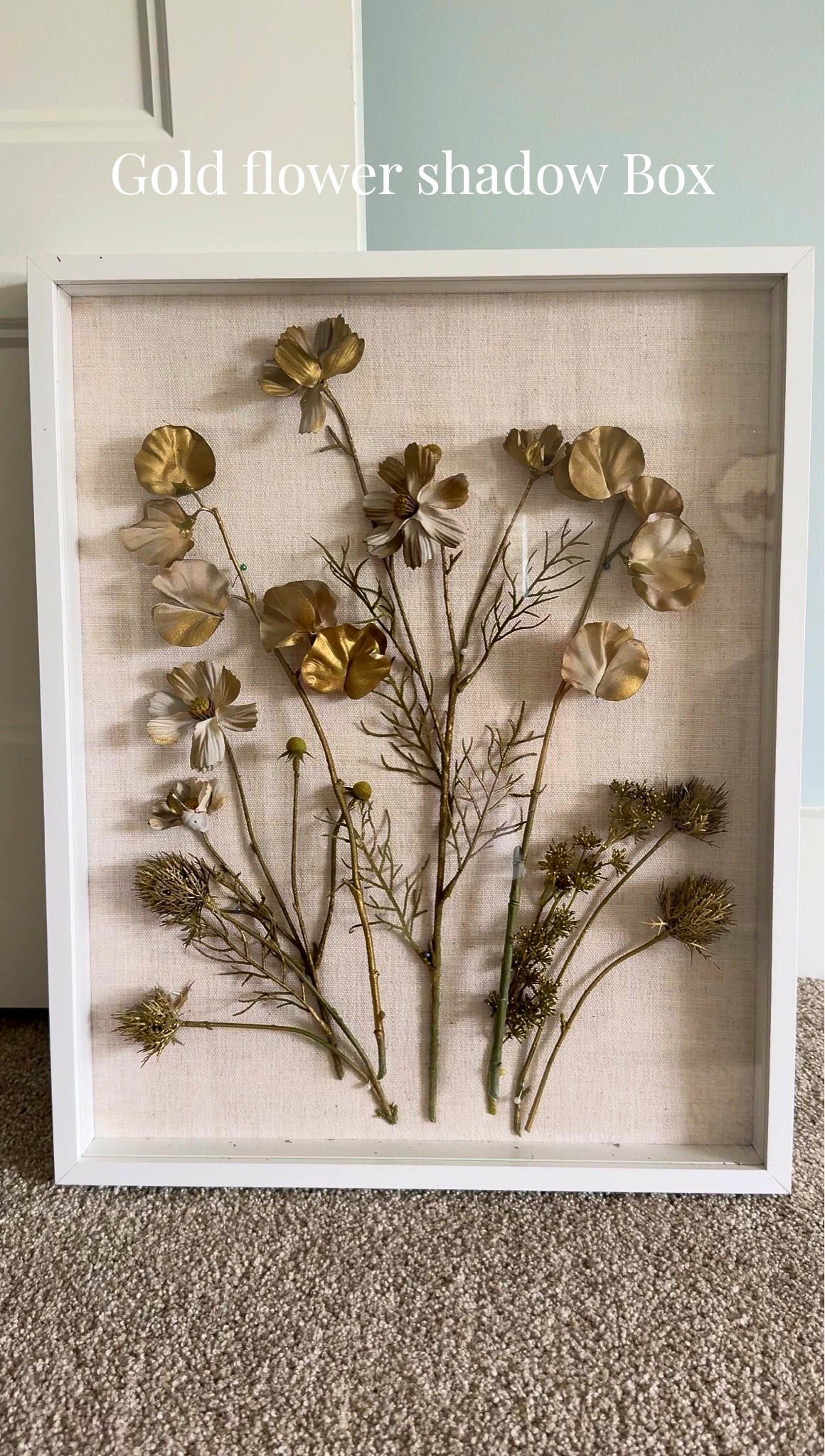 Not artistic? No problem. You don’t need to be to make this art! I used a shadow box, wrapped it in linen fabric, then spray-painted some fabric stems gold. After they dried, I pinned them onto the board and secured the back. 
You don’t even need to be crafty to pull this one together. But the end result was pretty satisfying. 

#crafting #flowershadowbox #art #decoratingprojects

#LTKHome