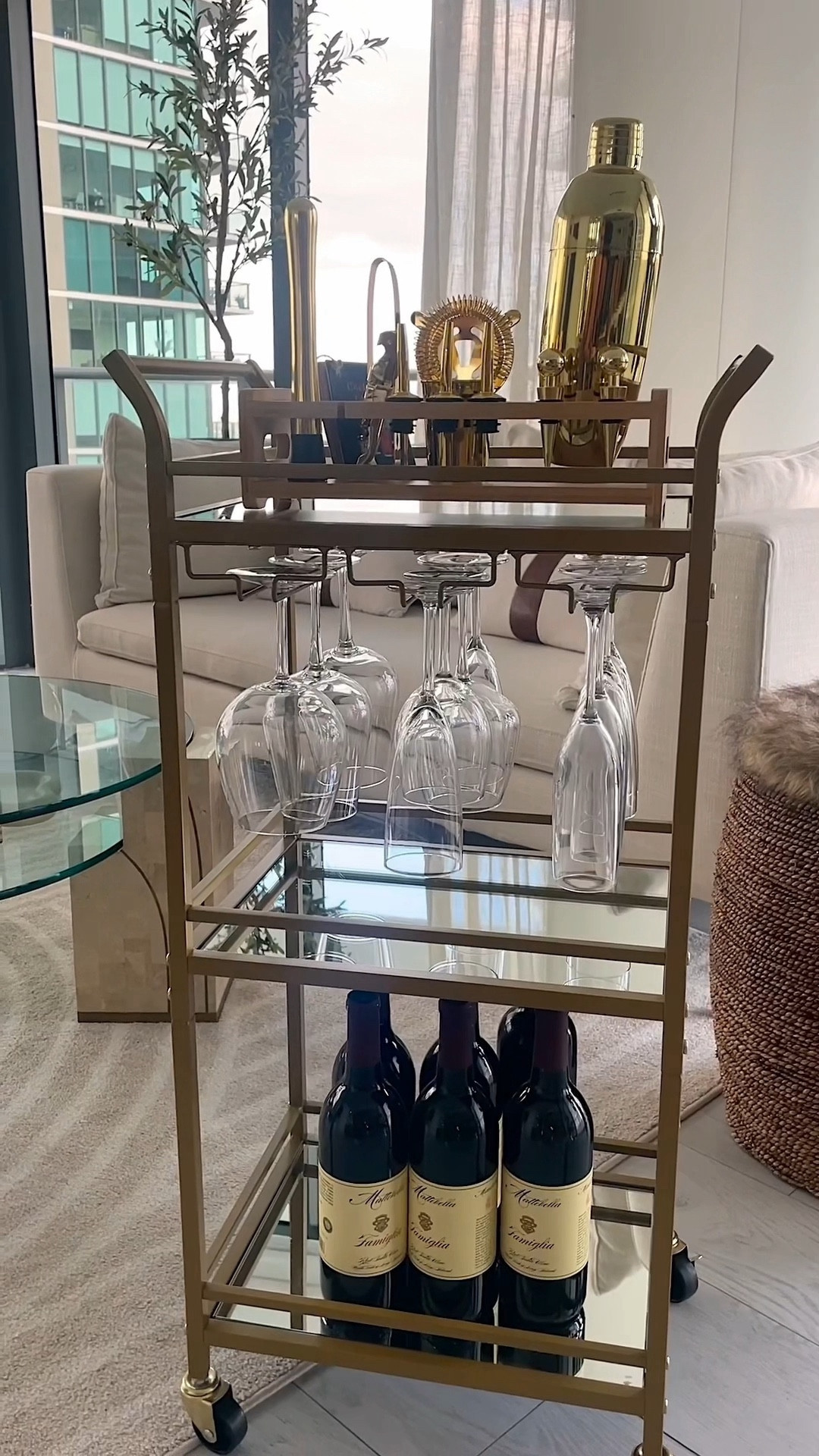 The cutest gold bar cart that has built in shelving for your glassware and mirrored shelving. ✨ Wine nights are elite now❤️ 

#LTKfindsunder50 #LTKVideo #LTKGiftGuide