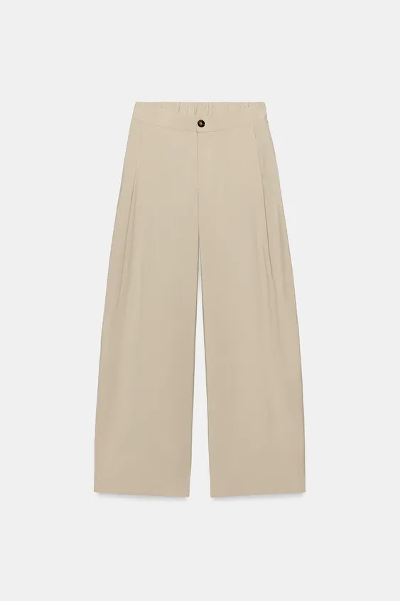 Model height: 178 cmHigh-waist trousers with front darts and an elastic waistband at the back. Fe... | Zara UK