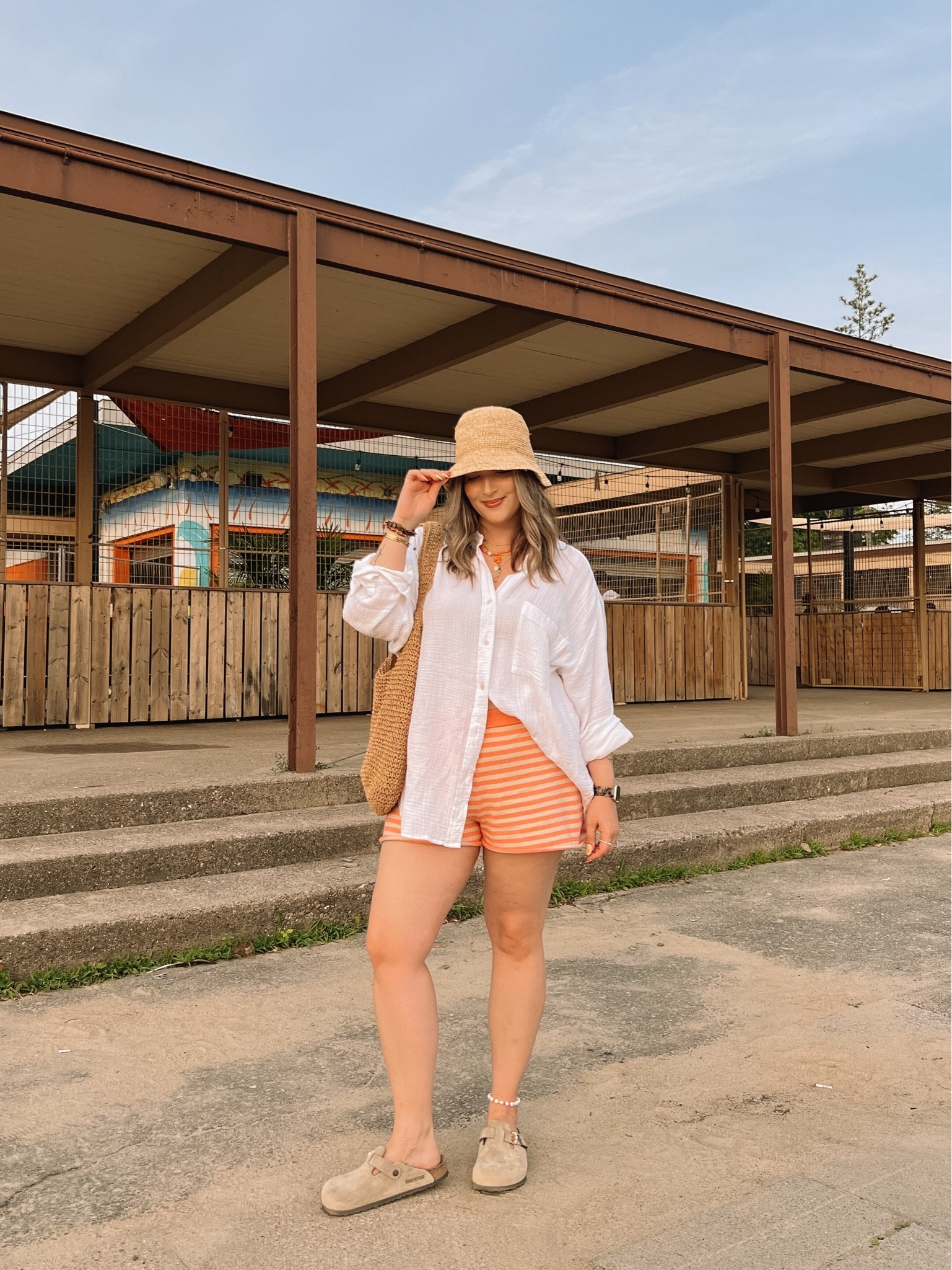 Beach outfit! Wearing my usual size L in both the striped shorts and oversized white button up. I’m a 9.5-10 and wear a 40 in the Birkenstock Boston clogs. Linked similar straw bucket hats

#LTKsummer #LTKmidsize #LTKstyletip