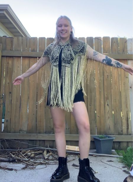 Greta Van Fleet Starcatcher concert outfit. Beaded fringe cape in gold/black with dr martens 

#LTKstyletip #LTKshoecrush #LTKFind