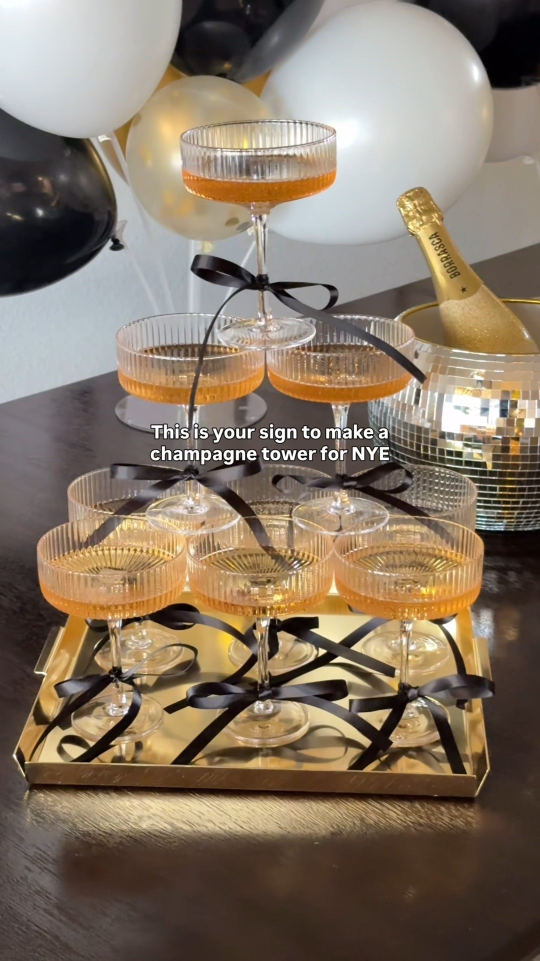 Champagne tower for New Year’s Eve party 🍾🥂
•
•
Coupe glasses, champagne glasses, champagne tower, New Year’s Eve, nye, nye 2026, New Year’s party, party ideas, hosting, bows on stemware, bows on wine glass 

#LTKFindsUnder50 #LTKfoodie #LTKHoliday